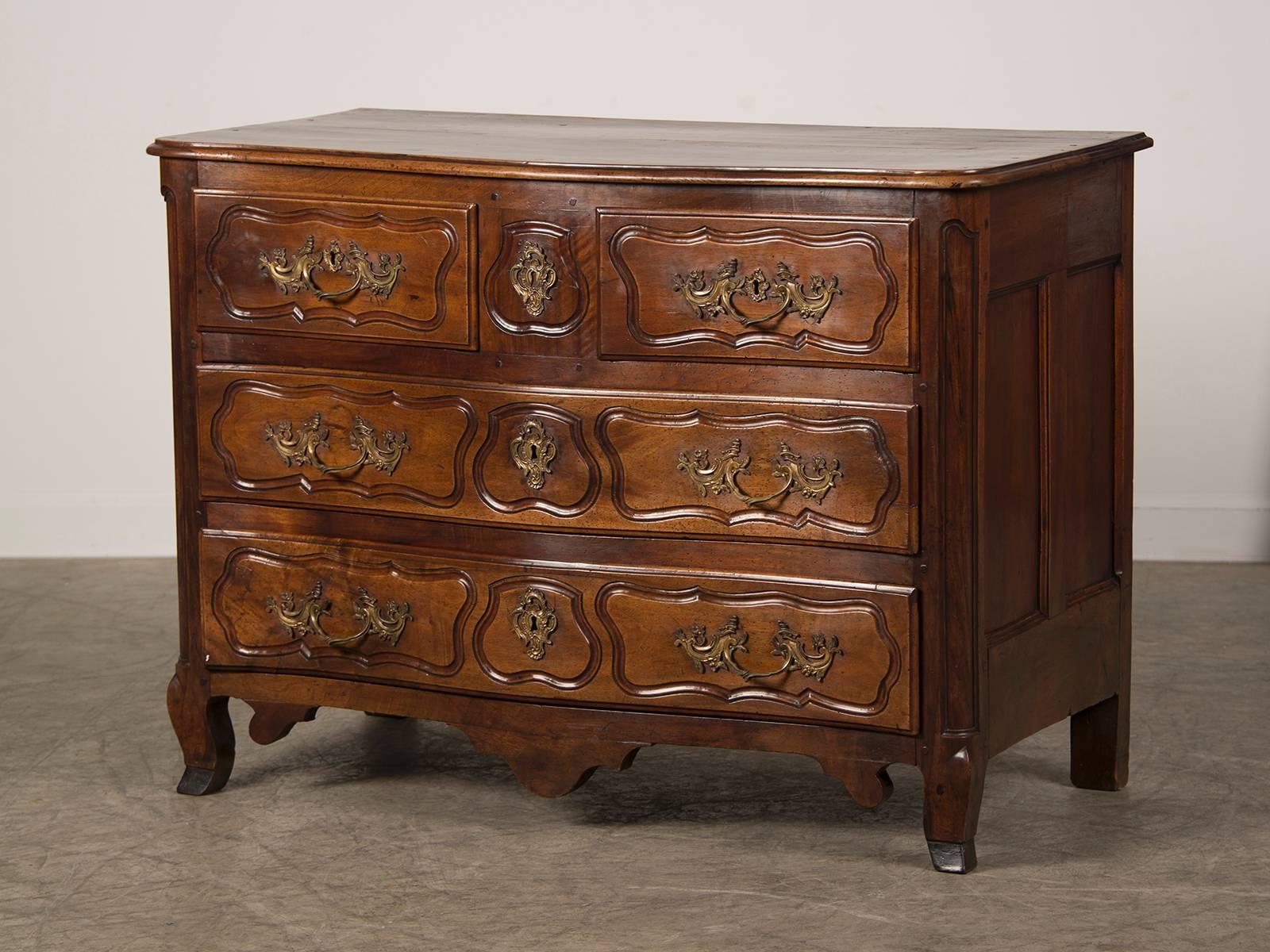 Receive our new selections direct from 1stdibs by email each week. Please click Follow Dealer below and see them first!

A Louis XV period antique French Provençal walnut commode circa 1750 with a serpentine front having two short drawers above