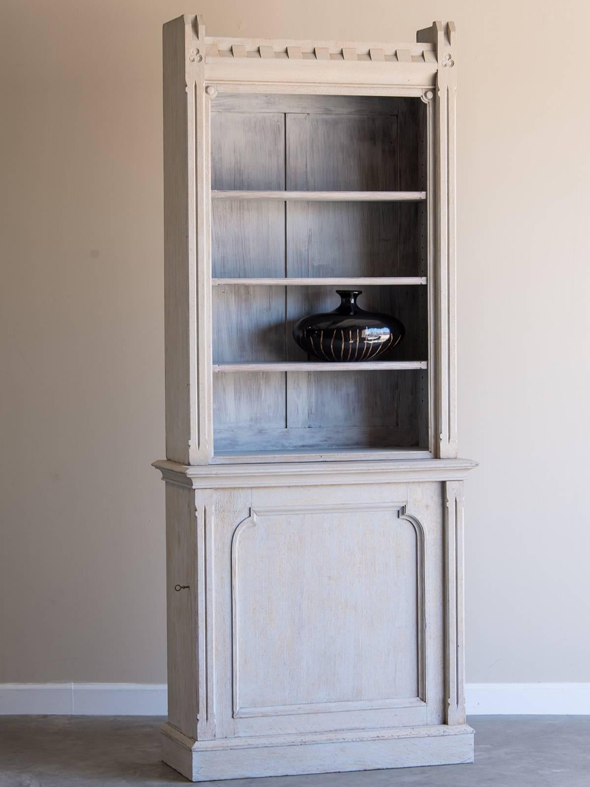 Receive our new selections direct from 1stdibs by email each week. Please click Follow Dealer below and see them first!

Shallow antique English painted oak display cabinet bookcase circa 1875. The crenellated pattern on the top open section gives