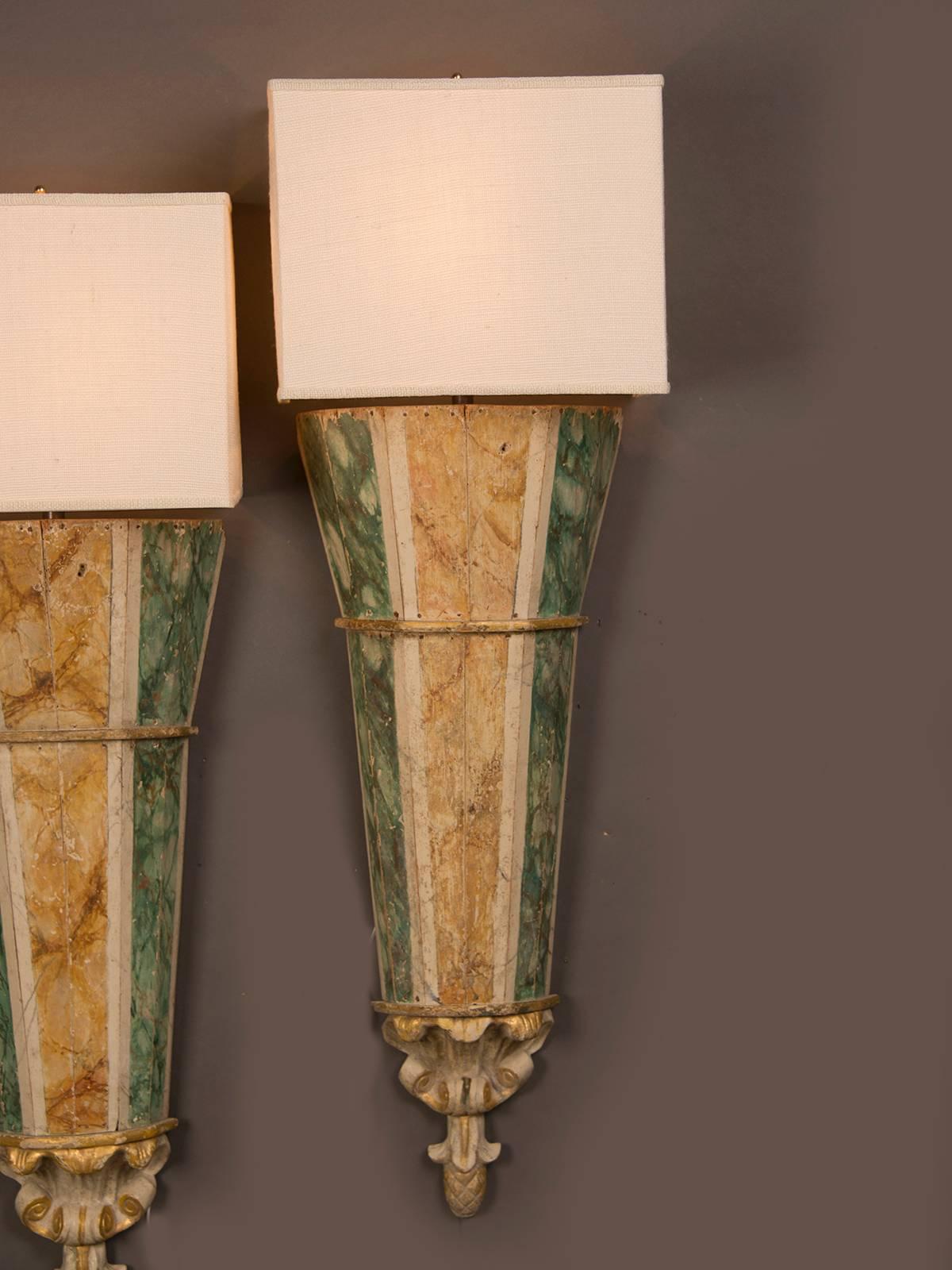 Receive our new selections direct from 1stdibs by email each week. Please click Follow Dealer below and see them first!

A pair of sconces having a grand scale from Italy, circa 1820 each retaining the original painted finish on wood simulating