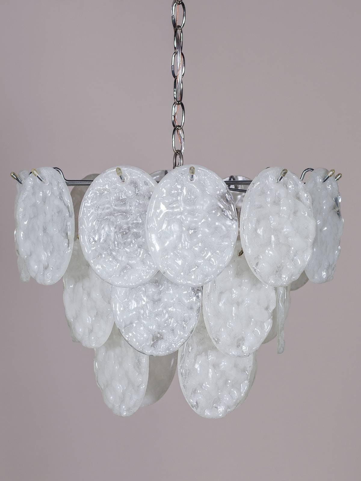 Receive our new selections direct from 1stdibs by email each week. Please click Follow Dealer below and see them first!

This modern Italian chandelier, circa 1970 features a chrome frame that suspends three levels of translucent oval drops in a