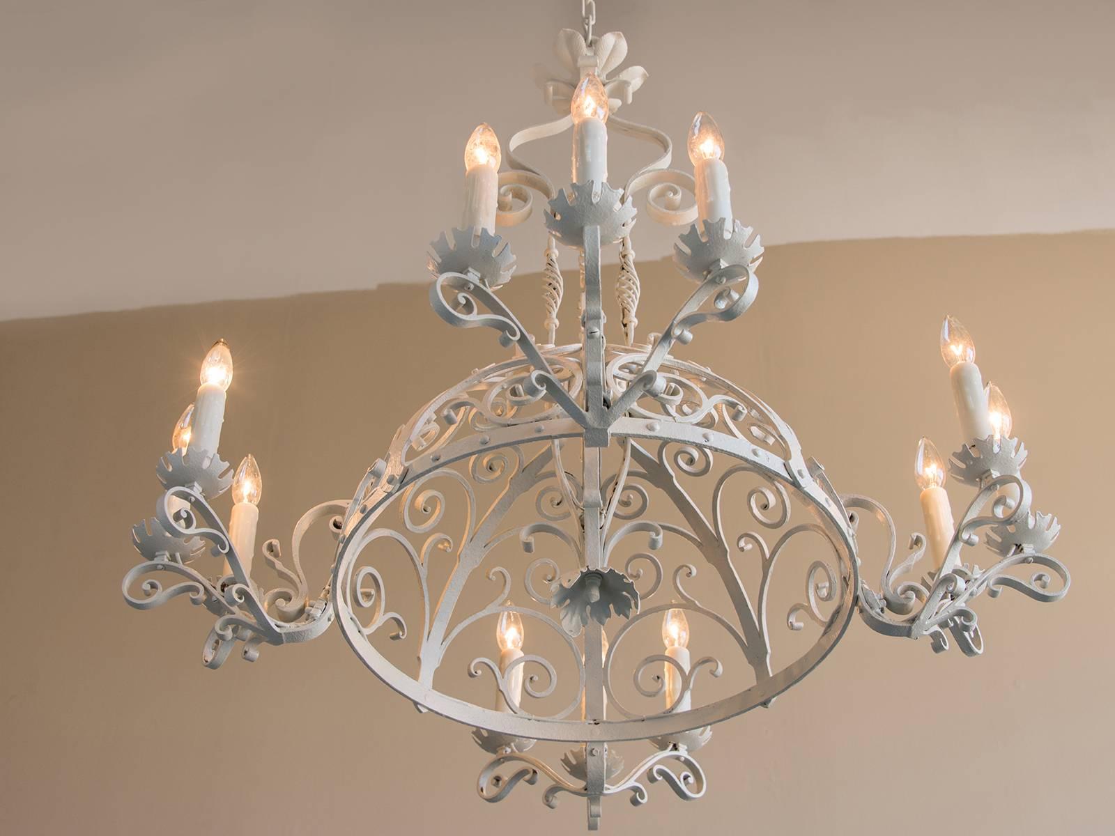 Receive our new selections direct from 1stdibs by email each week. Please click Follow Dealer below and see them first!

The elegant iron work on this chandelier circa 1910 showcases a variety of motifs that give it an attractive appeal. This