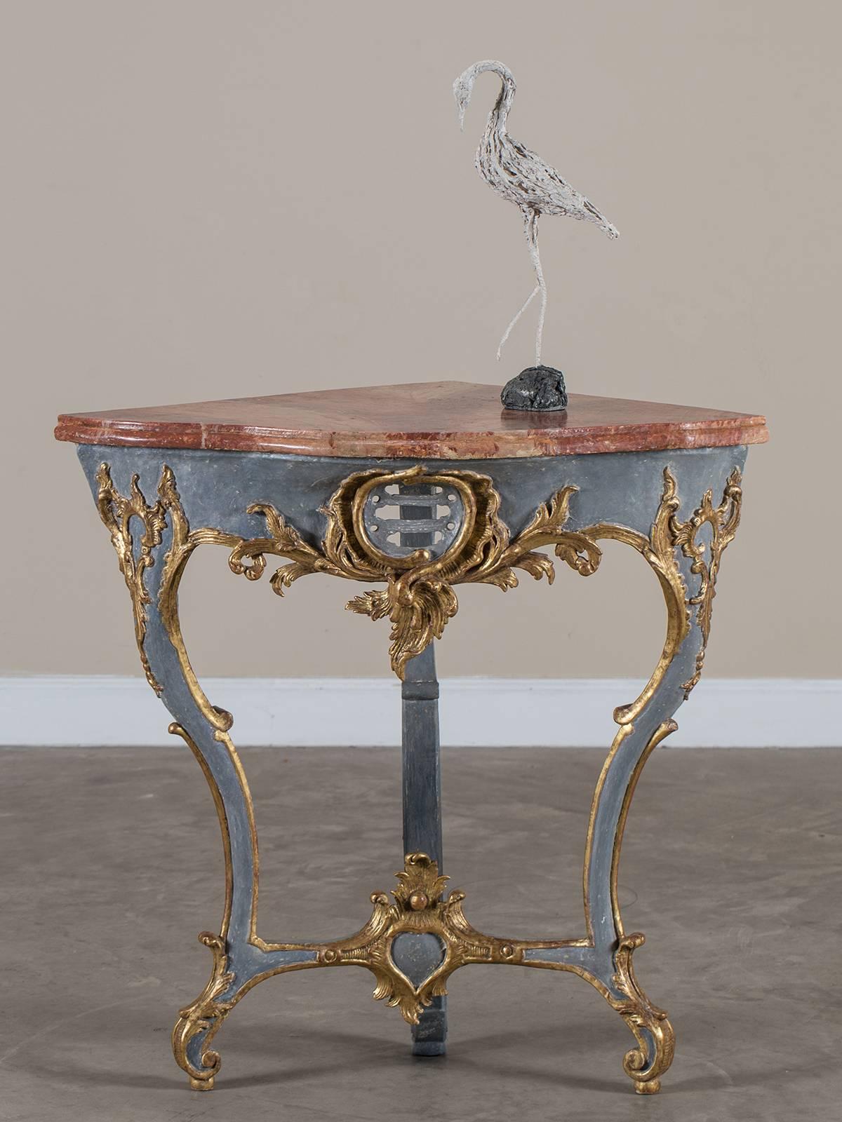 Receive our new selections direct from 1stdibs by email each week. Please click Follow Dealer below and see them first!

The beautiful color and carving on this unusual antique Austrian corner console table highlight its origin from the Rococo