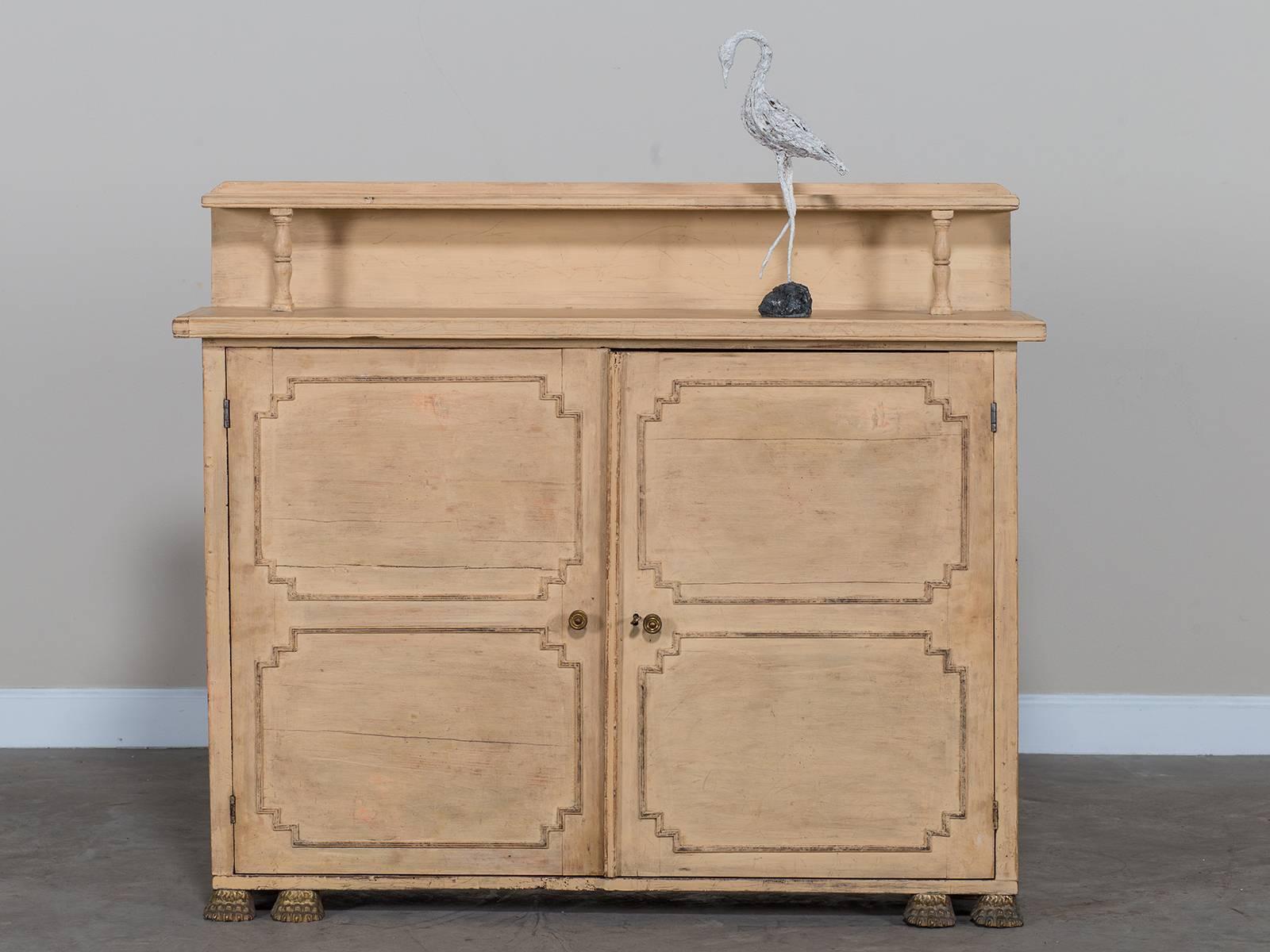 Receive our new selections direct from 1stdibs by email each week. Please click Follow Dealer below and see them first!

This antique English chiffonier dates from the Regency period circa 1830 and is notable for its painted finish and brass paw