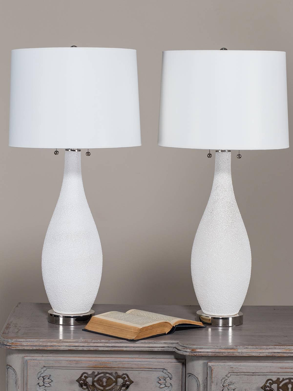 Receive our new selections direct from 1stdibs by email each week. Please click Follow Dealer below and see them first!

The elegant shape of this pair of Mid-Century vintage lamps, circa 1950 makes them eminently desirable for a contemporary