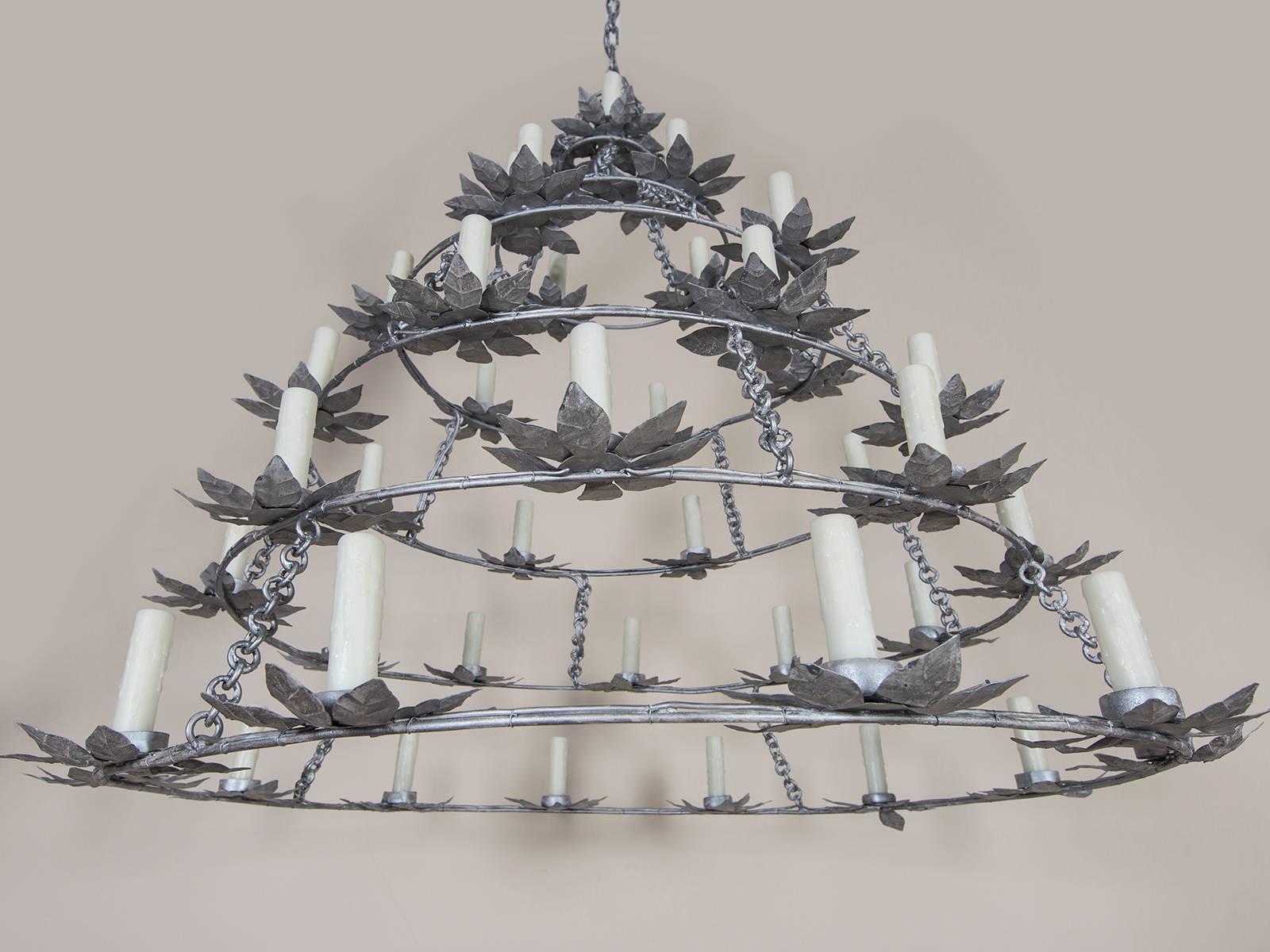 Receive our new selections direct from 1stdibs by email each week. Please click Follow Dealer below and see them first!

The intiguing series of multiple rings on this vintage French painted round iron chandelier circa 1970 gives it a unique