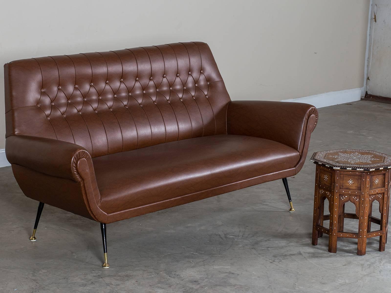 Receive our new selections direct from 1stdibs by email each week. Please click Follow Dealer below and see them first!

The stylish profile of this sofa are immediately identifiable as Italian in origin.  The sofa stands upon four metal legs set