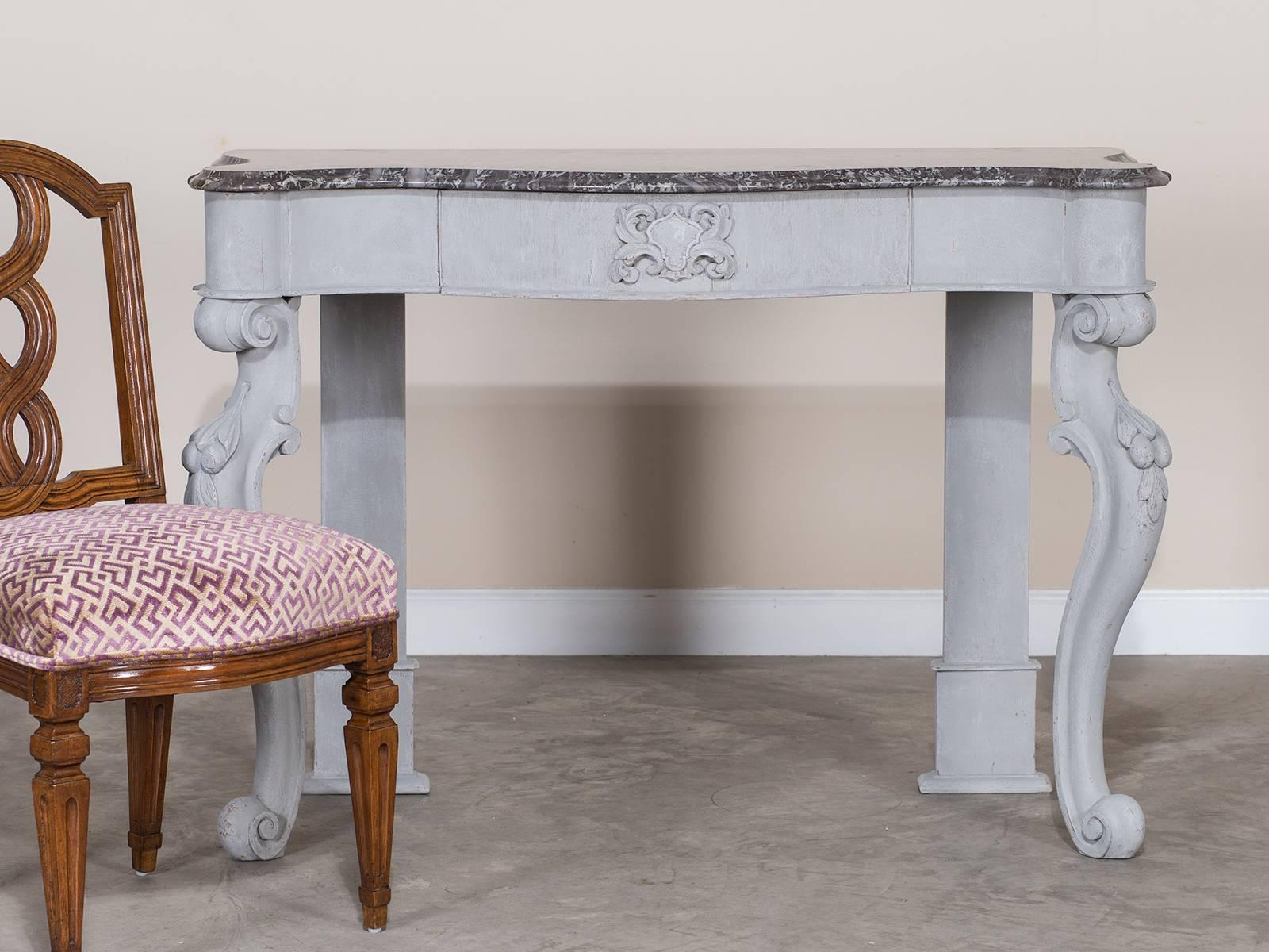 Receive our new selections direct from 1stdibs by email each week. Please click Follow Dealer below and see them first!

An English painted oak William Kent style console table with a black marble top, circa 1850. This beautiful console table