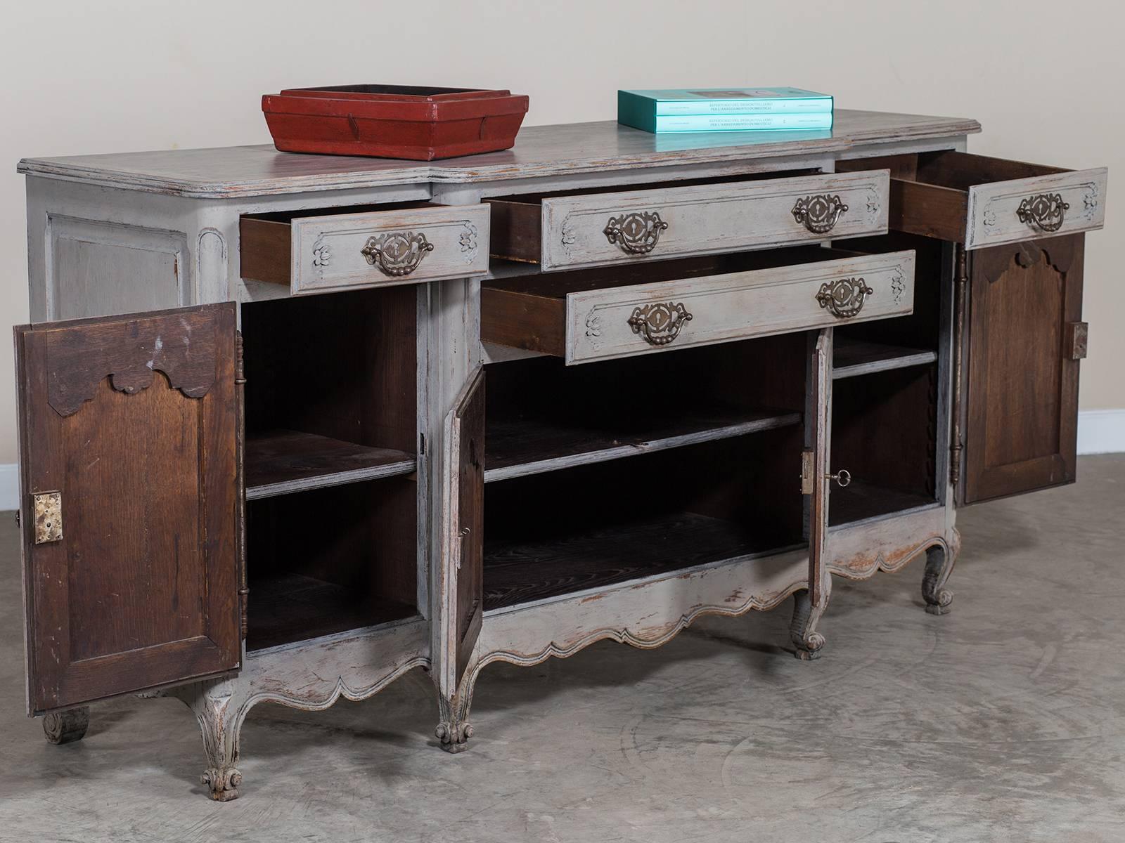 Receive our new selections direct from 1stdibs by email each week. Please click Follow Dealer below and see them first!

The excellent carved details and unusual configuration of cabinets and drawers give this antique French buffet credenza, circa