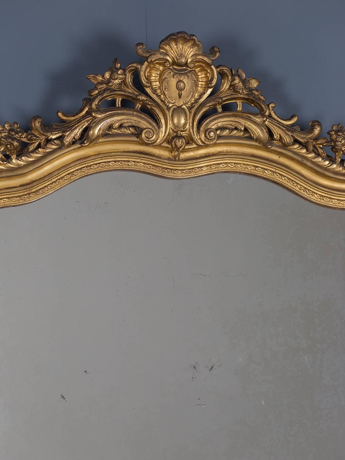 Receive our new selections direct from 1stdibs by email each week. Please click follow dealer below and see them first!

The elegant Regency cartouche seen at the top of this antique French Louis Philippe mirror, circa 1880 gives this mirror a