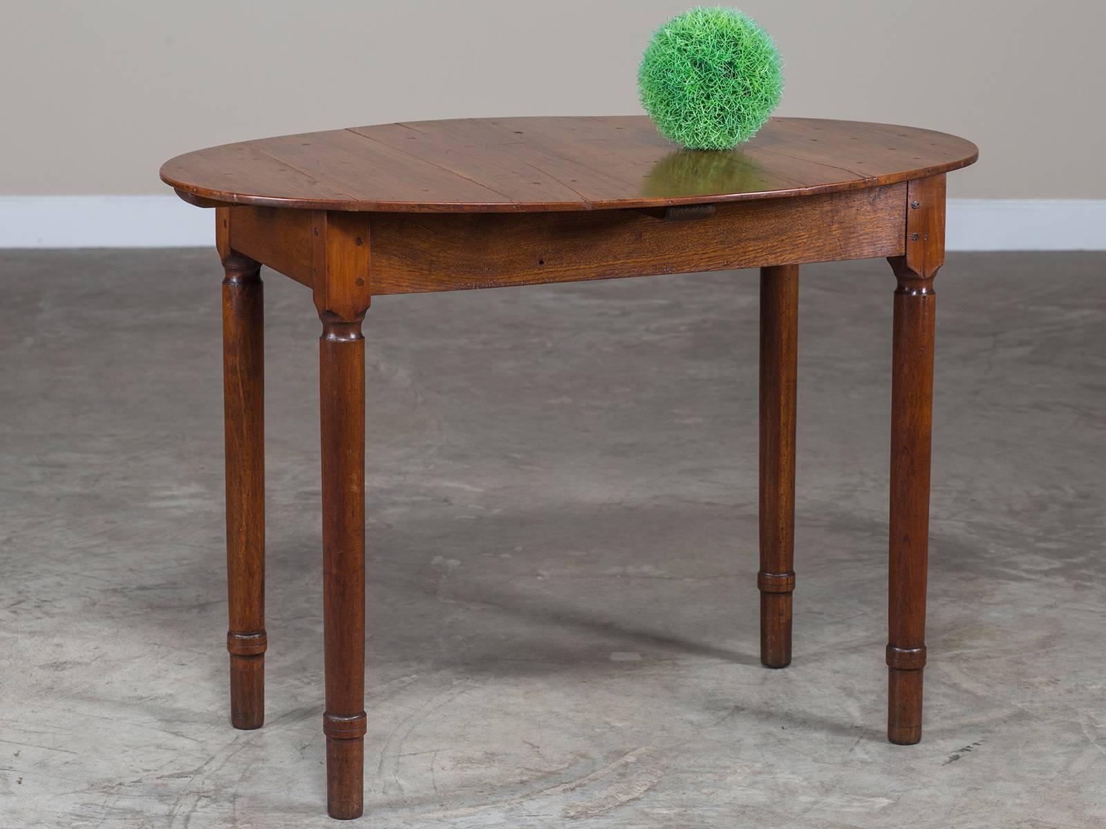 Receive our new selections direct from 1stdibs by email each week. Please click “Follow Dealer” button below and see them first!

This oval top antique French cherry and oak table circa 1830 has a stylish simplicity that is perfect for a modern