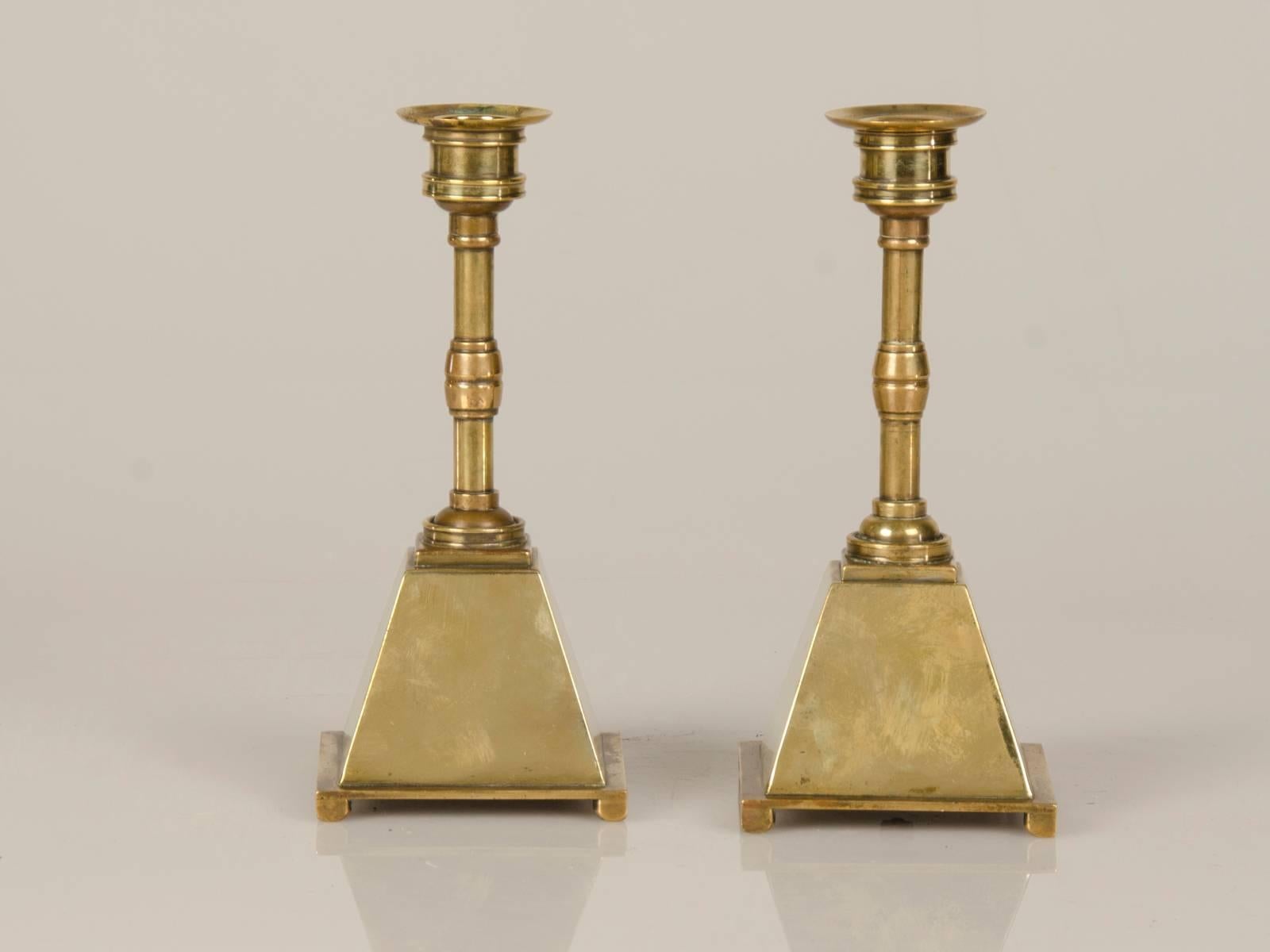 Receive our new selections direct from 1stdibs by email each week. Please click “Follow Dealer” button below and see them first!

A pair of English Arts and Crafts period brass candlesticks with a unique shape, circa 1885. These candlesticks have a