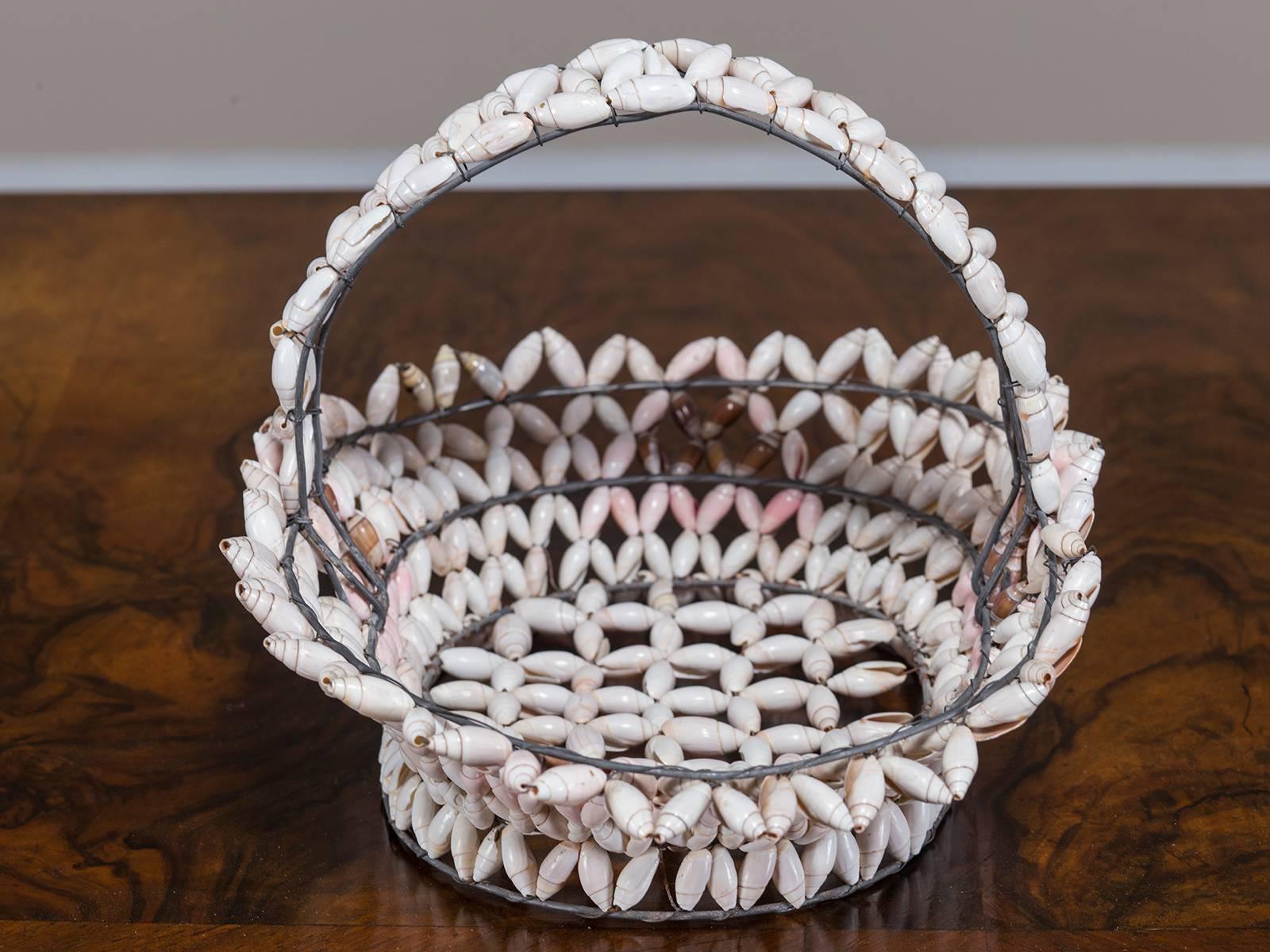Receive our new selections direct from 1stdibs by email each week. Please click “Follow Dealer” button below and see them first!

The classic oval shape of this handmade wire basket is embellished with carefully chosen sea shells that remain in