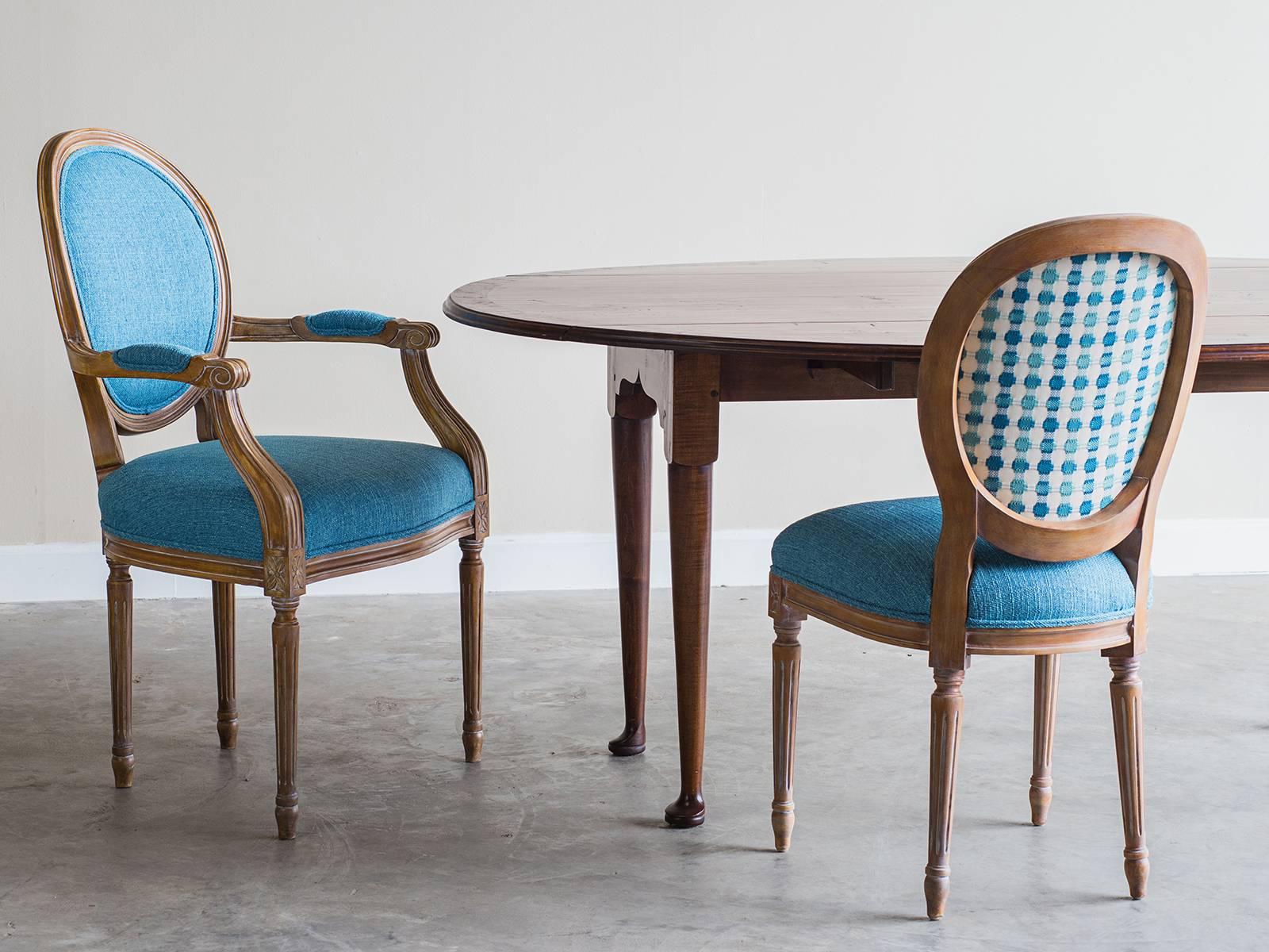 Receive our new selections direct from 1stdibs by email each week. Please click Follow Dealer below and see them first!

A set of oval back Louis XVI style dining chairs with a painted finish from France now custom upholstered in turquoise linen.