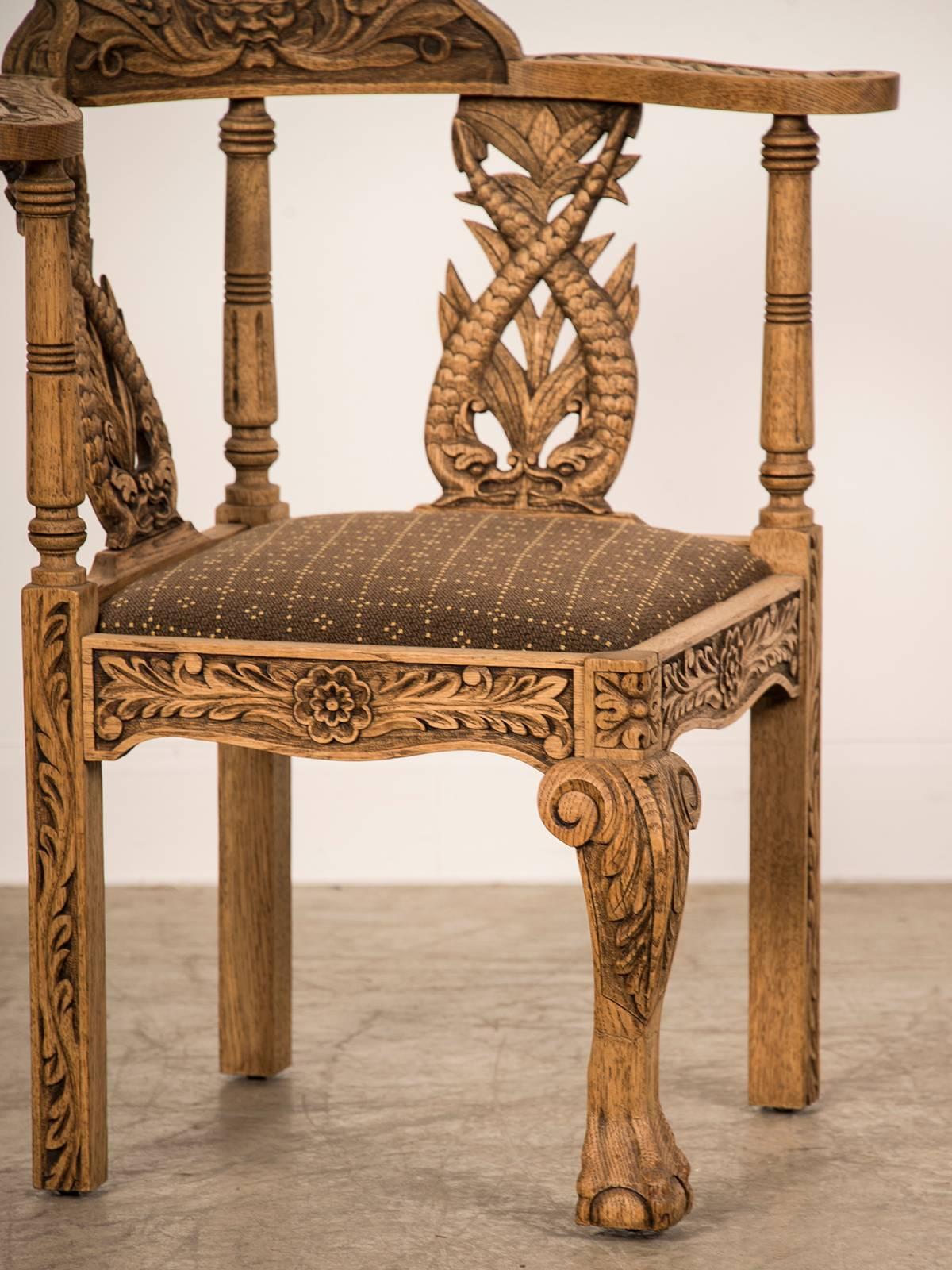 Receive our new selections direct from 1stdibs by email each week. Please click Follow Dealer below and see them first!

An antique English George III style pale oak corner chair, circa 1895 featuring exuberant carved details which include two