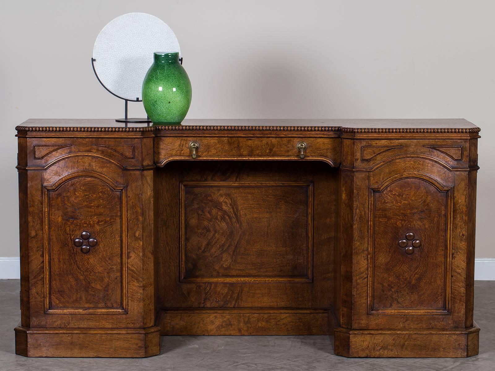 Receive our new selections direct from 1stdibs by email each week. Please click on “Follow Dealer” button below and see them first!

This handcrafted pollard oak antique English buffet credenza, circa 1865 possesses a unique shape and colour along