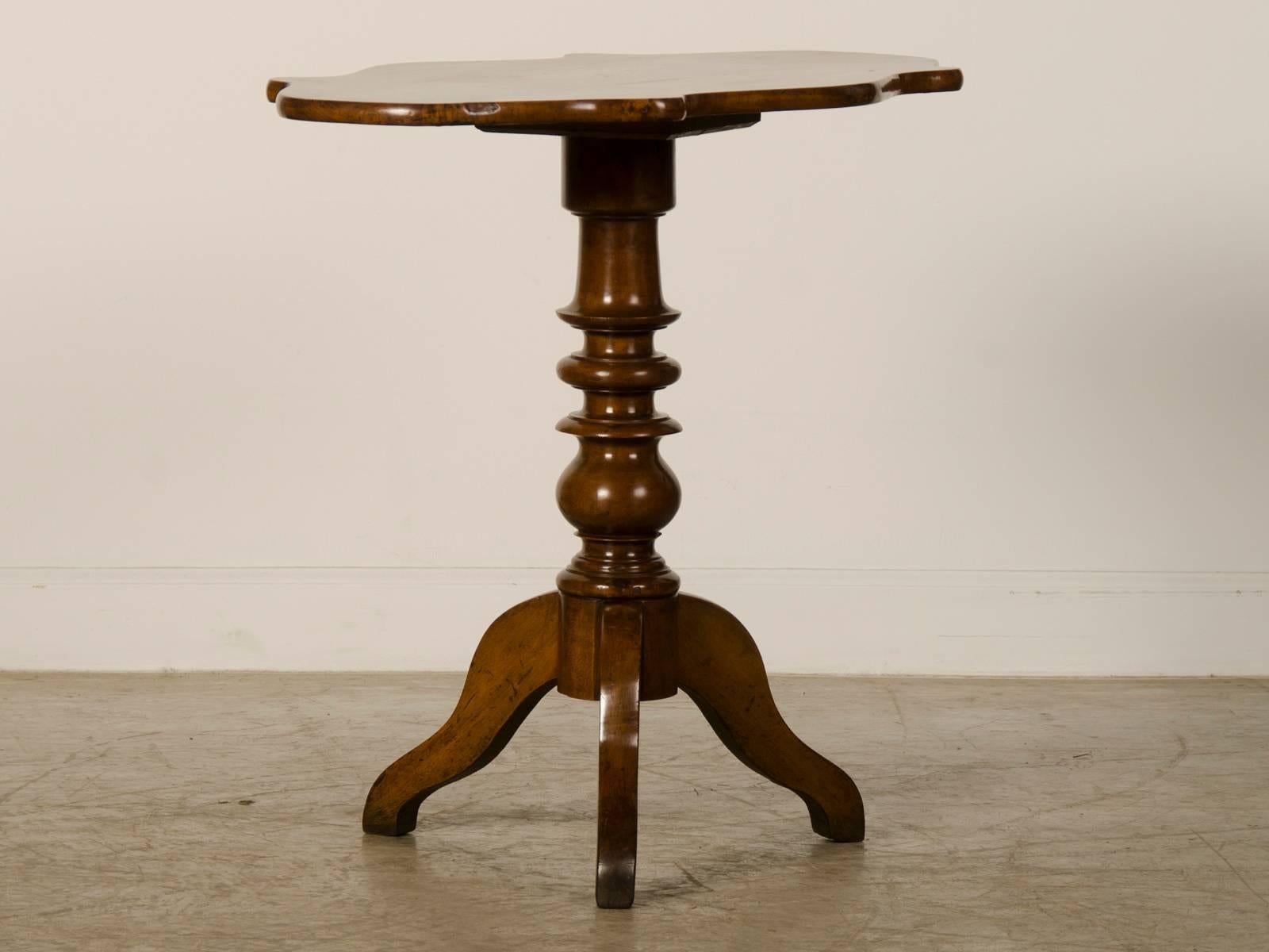 Receive our new selections direct from 1stdibs by email each week. Please click follow dealer below and see them first!

A unique antique English mahogany table with a shaped top, circa 1860. This side table takes advantage of luminous quality of