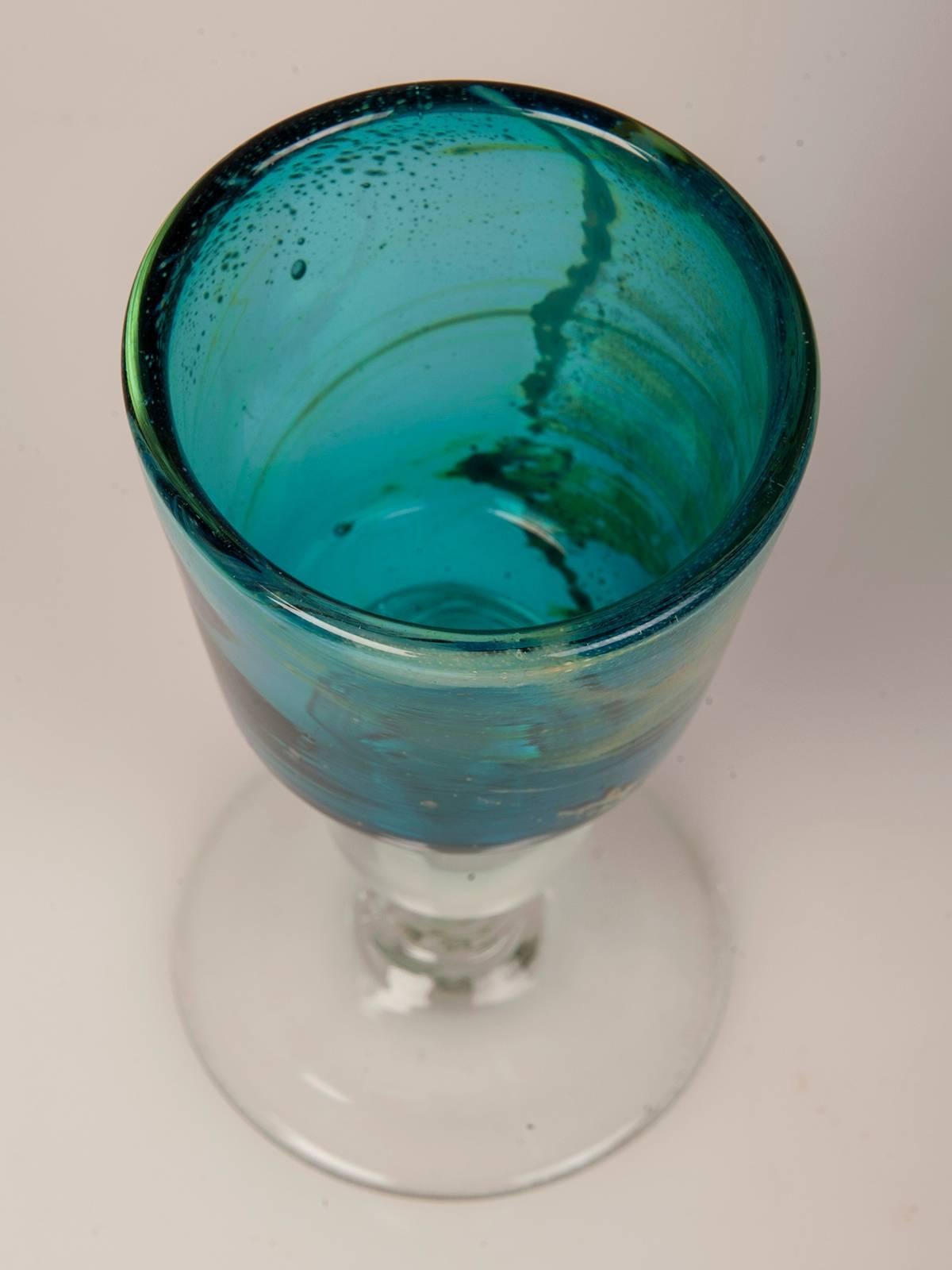 Be the first to see our new arrivals directly through 1stdibs! Please click follow dealer below. 

A circular goblet featuring the enchanting turquoise color of handblown Mdina Glass from Malta, circa 1975. Designed and made by Englishman Michael