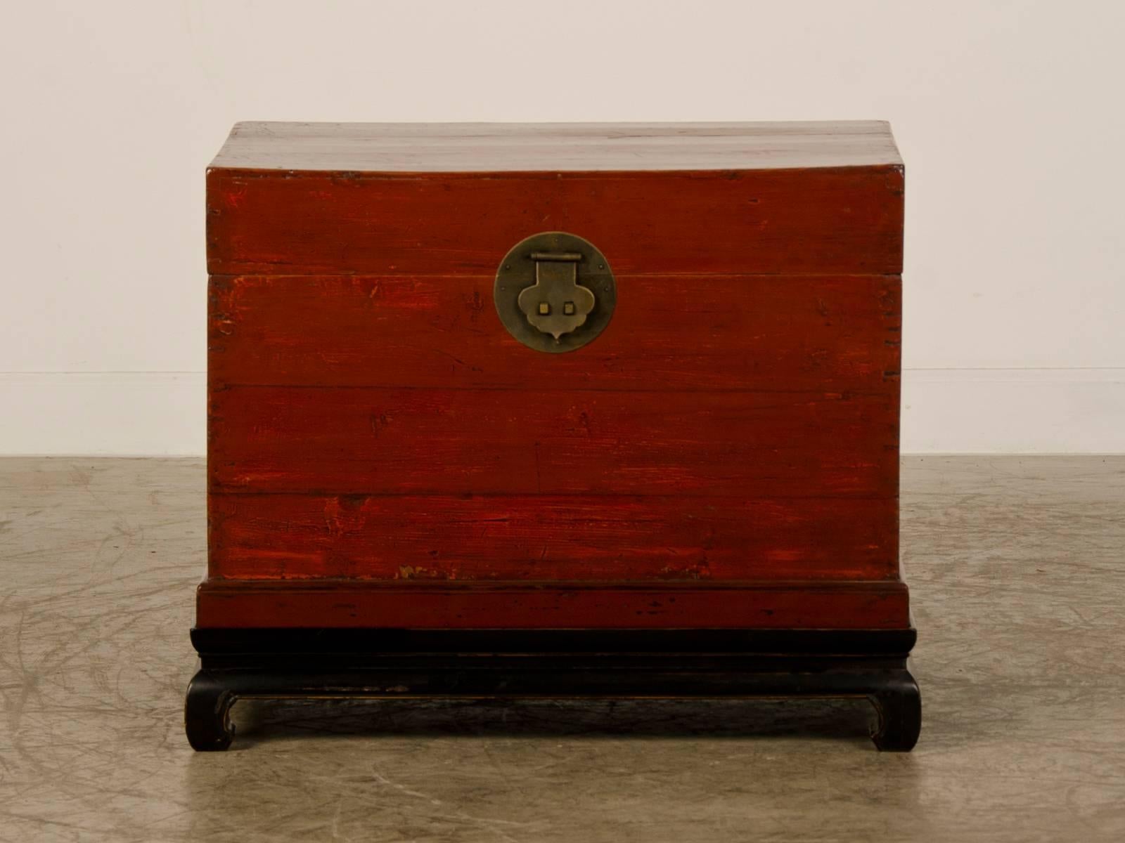 Be the first to see our new listings direct from 1stdibs! Please click Follow below.

A handsome antique Chinese red lacquer trunk from the Kuang Hsu period in China, circa 1875. The trunk as the original metal hardware and is now raised on a