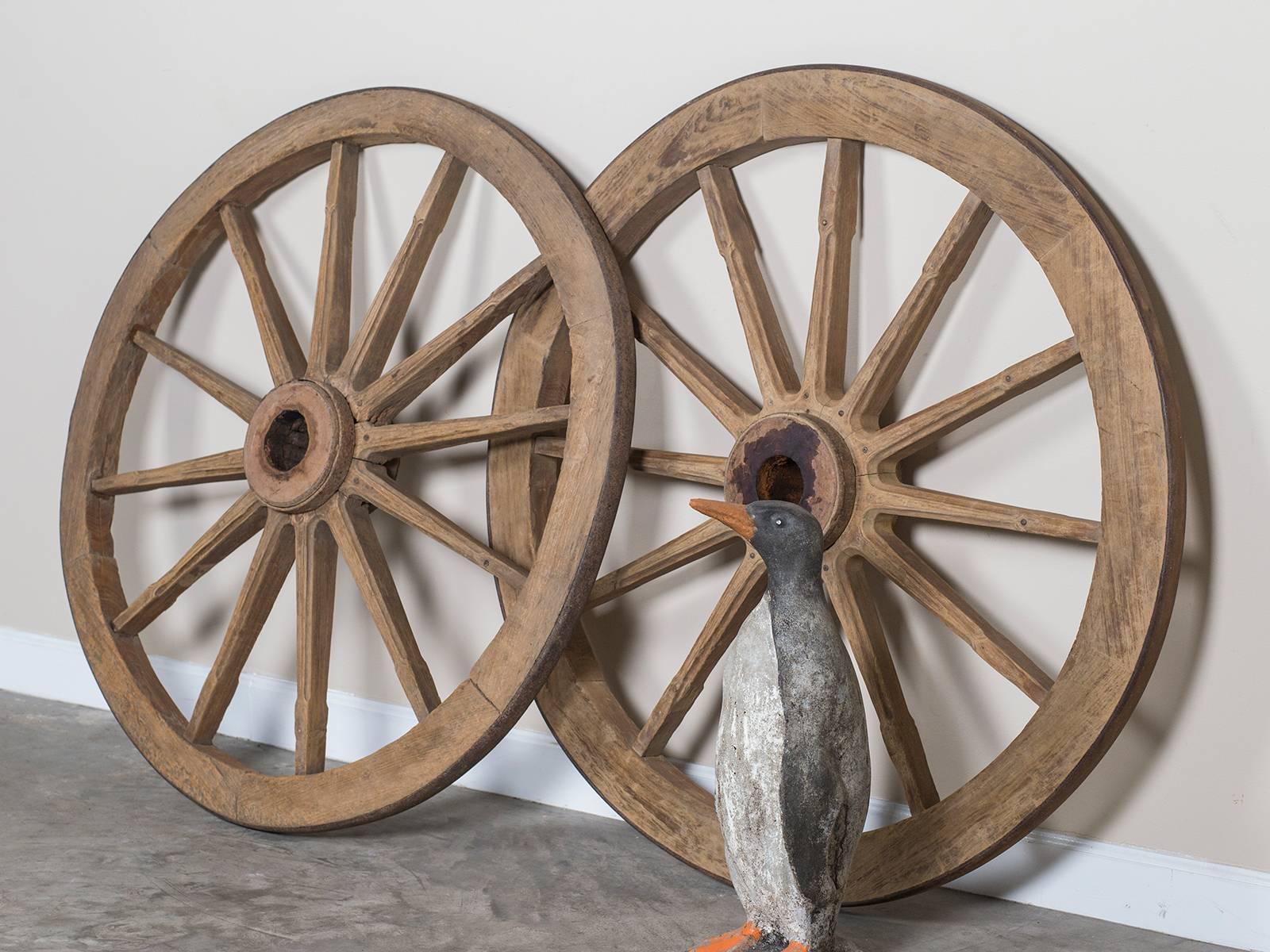 Industrial Pair of Antique French Iron Bound Wagon Wheels, circa 1880