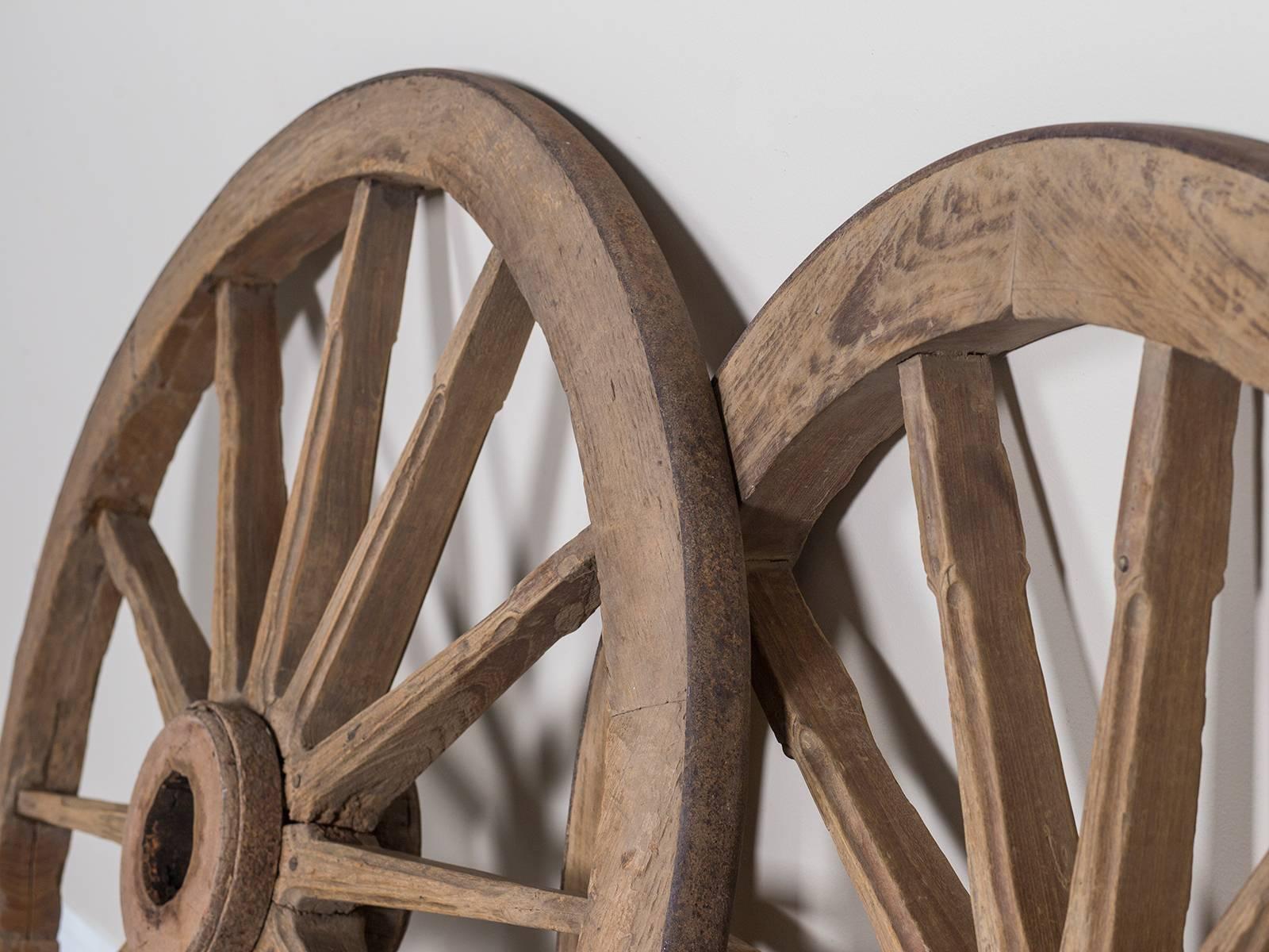 Hand-Carved Pair of Antique French Iron Bound Wagon Wheels, circa 1880