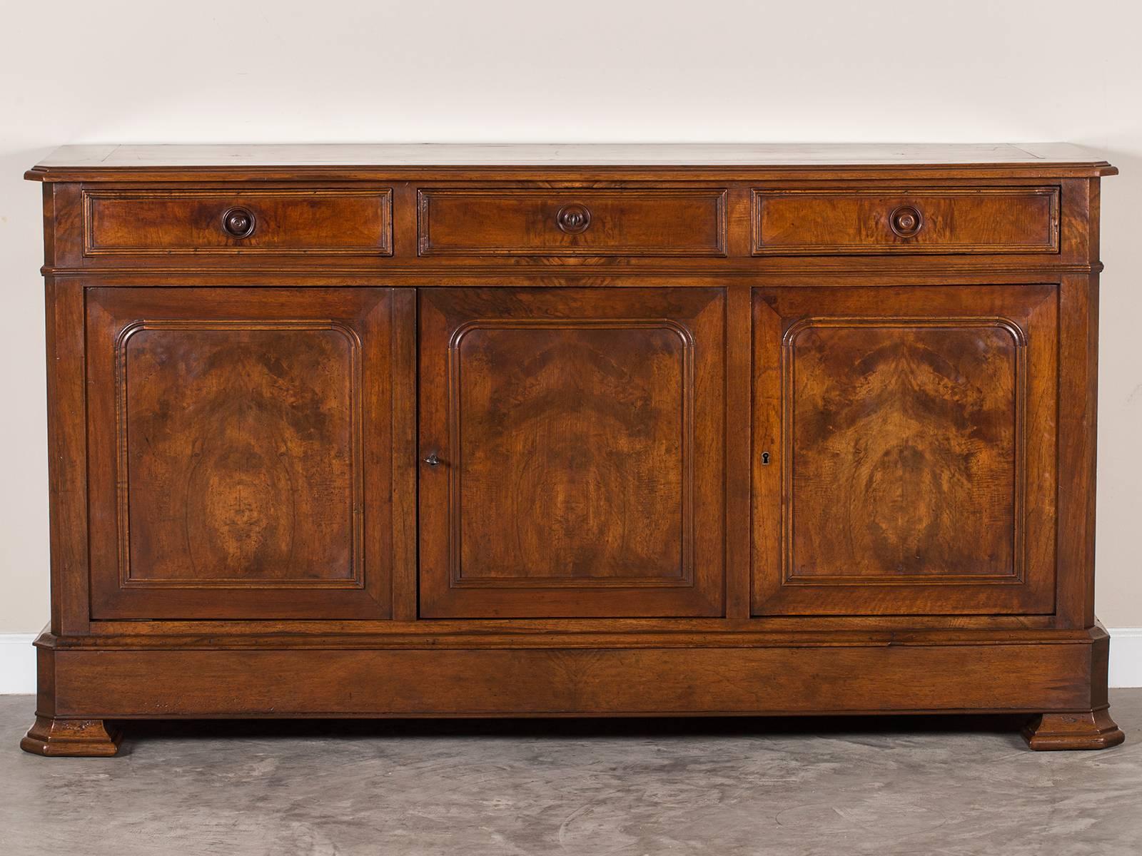 Be the first to see our new arrivals directly through 1stdibs! Please click follow dealer below. 

The handsome architectural lines of this antique French Louis Philippe enfilade buffet credenza, circa 1870 has an impressive appearance. Notice how