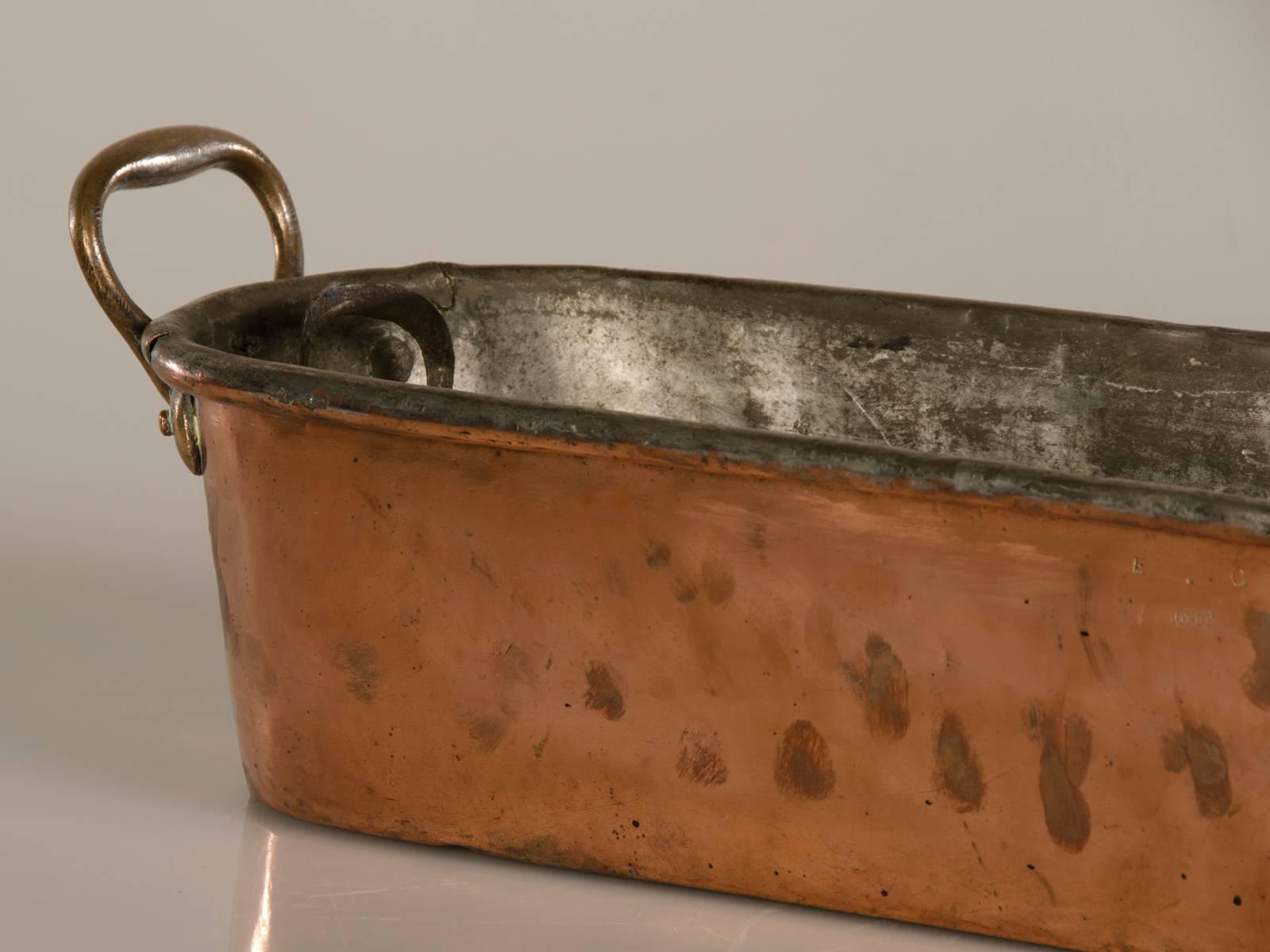 Be the first to see our new arrivals directly through 1stdibs! Please click follow dealer below. 

A rare oblong copper fish poacher with its original monogrammed liner from France, circa 1875. This is true surviving rarity from the kitchen of a