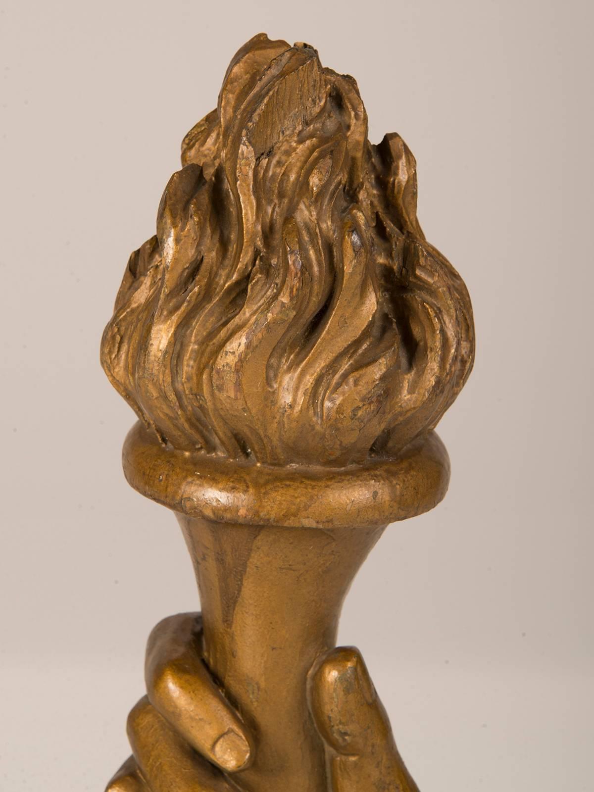Be the first to see our new arrivals directly through 1stdibs! Please click follow dealer below. 

A wonderful carved and gilded wood sculpture of a hand holding aloft a flaming torch from France, circa 1885. Please notice the resemblance to the