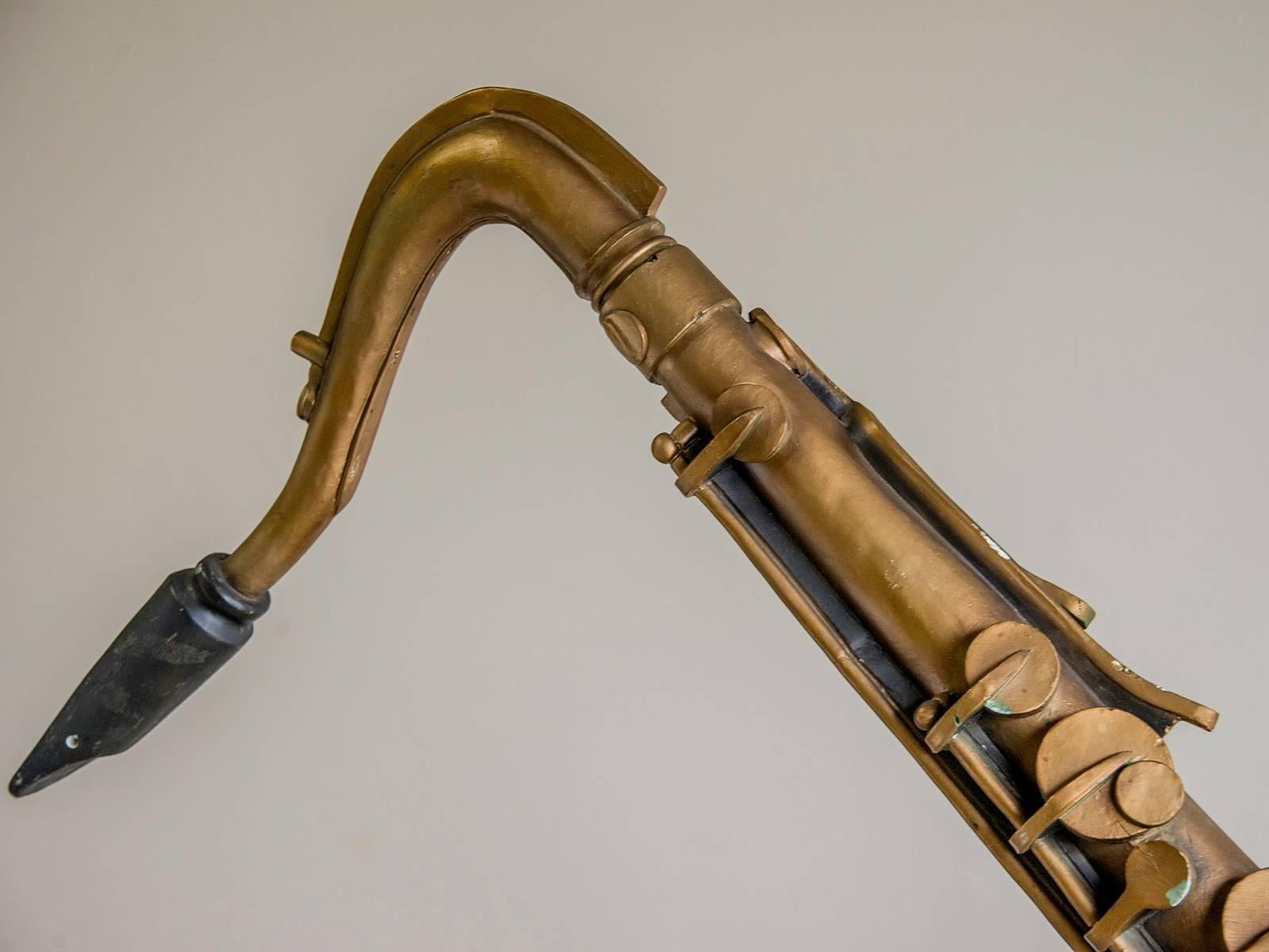 Be the first to see our new arrivals directly through 1stdibs! Please click follow dealer below. 

An enormous saxophone originally from a music store in Paris, France, circa 1940. Please look at the giant scale of this store prop made to suspend