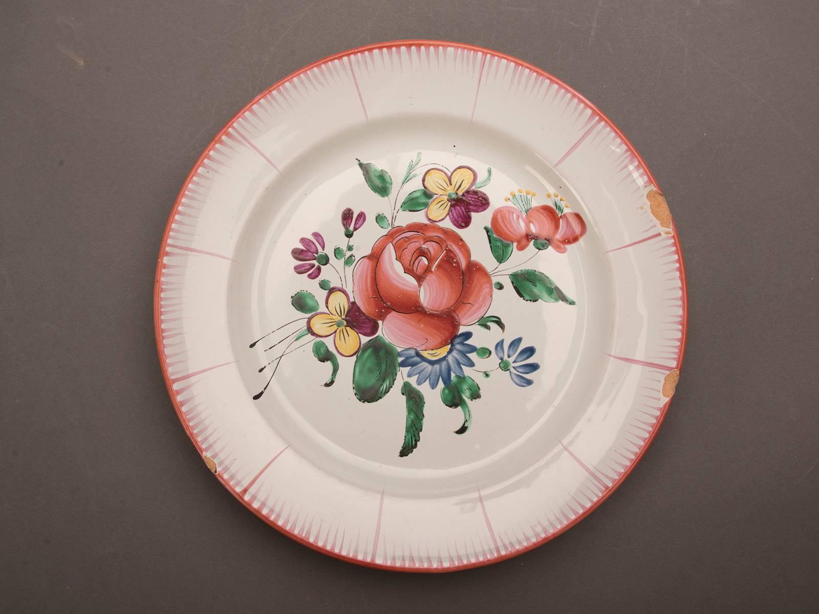 Be the first to see our new arrivals directly through 1stdibs! Please click follow dealer below. 

A set of eight antique French Barbotine earthenware plates, circa 1880 decorated with hand-painted flowers that are different on each plate. Please