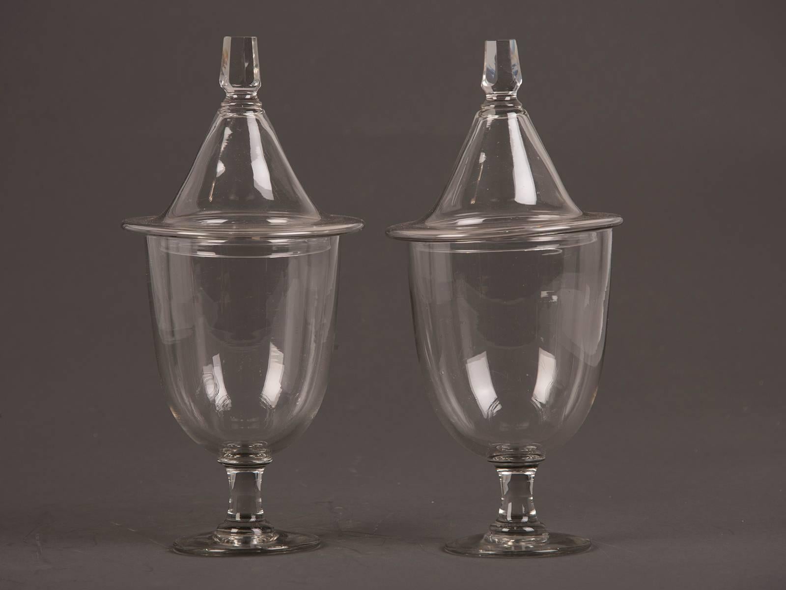 A pair of antique English Regency style glass urns each with a lid, England, circa 1875.