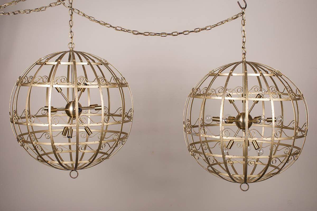 These stylish vintage French chandelier fixtures, circa 1950, were originally holiday decorations used in a department store where their richly reflective gold glitter surfaces sparkled and twinkled amongst the other lights. The metal parts create a