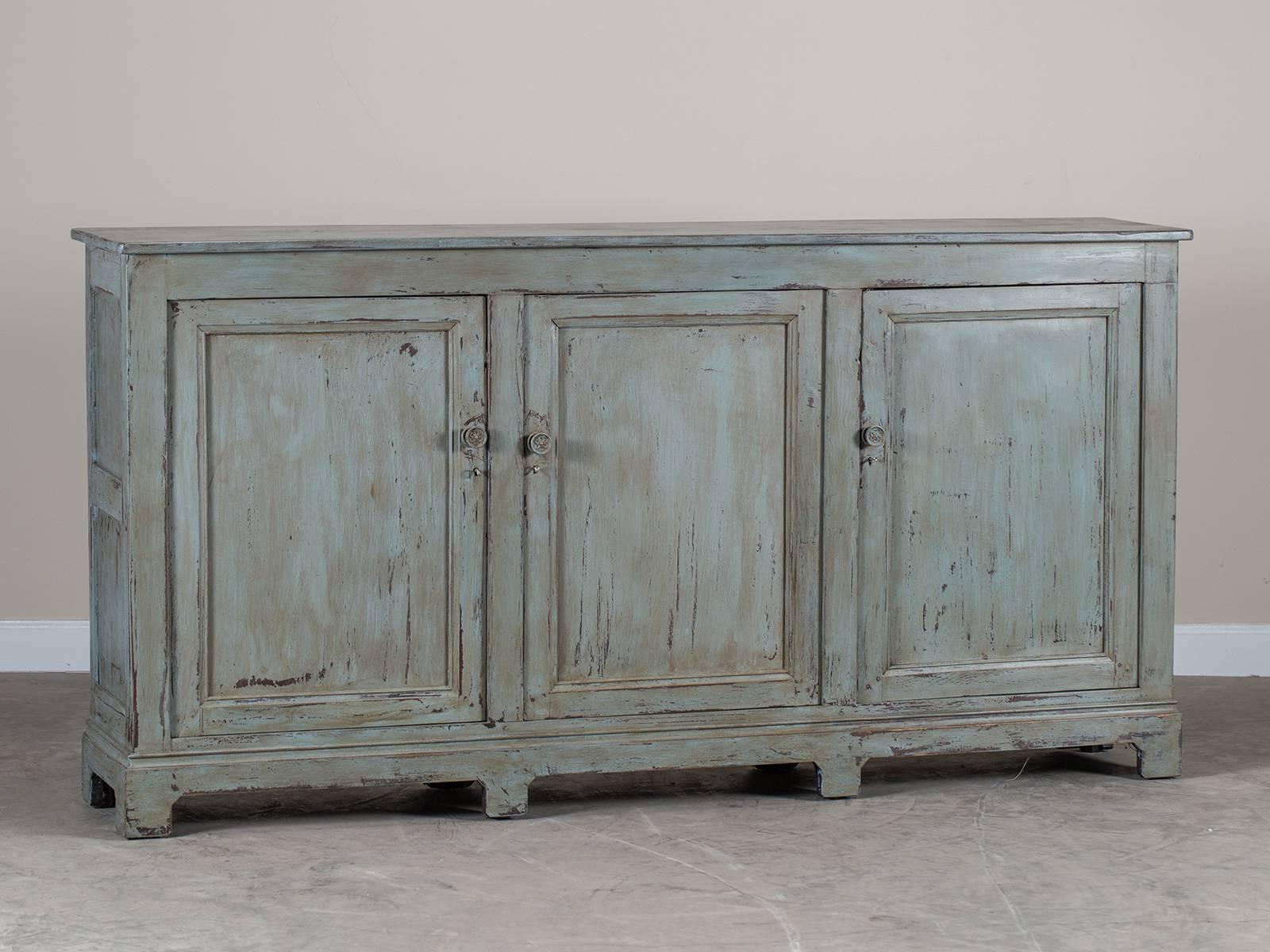 An unusually shallow Louis Philippe style painted enfilade from France c. 1870. Please take a moment and enlarge the additional photographs provided and zoom on the details that make this a handsome piece of furniture. By the middle of the