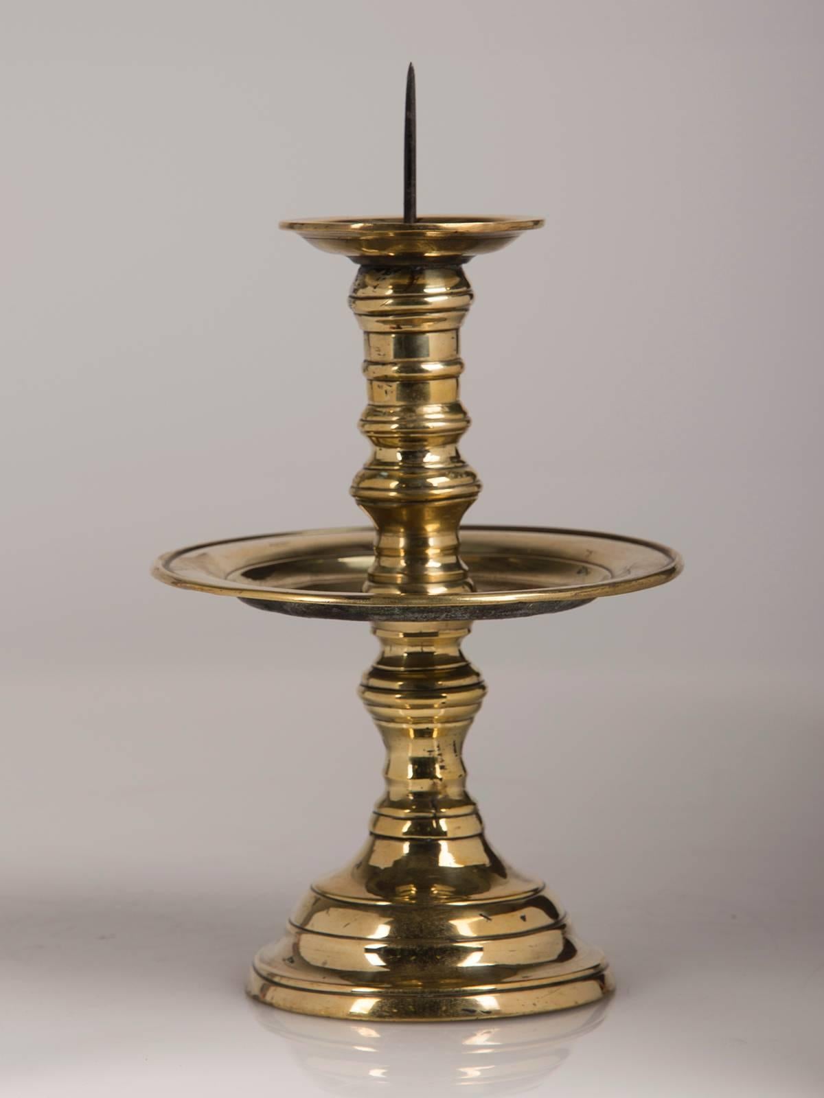 Receive our new selections direct from 1stdibs by email each week. Please click Follow Dealer below and see them first!

A pair of antique English George II period brass candlesticks circa 1740.
