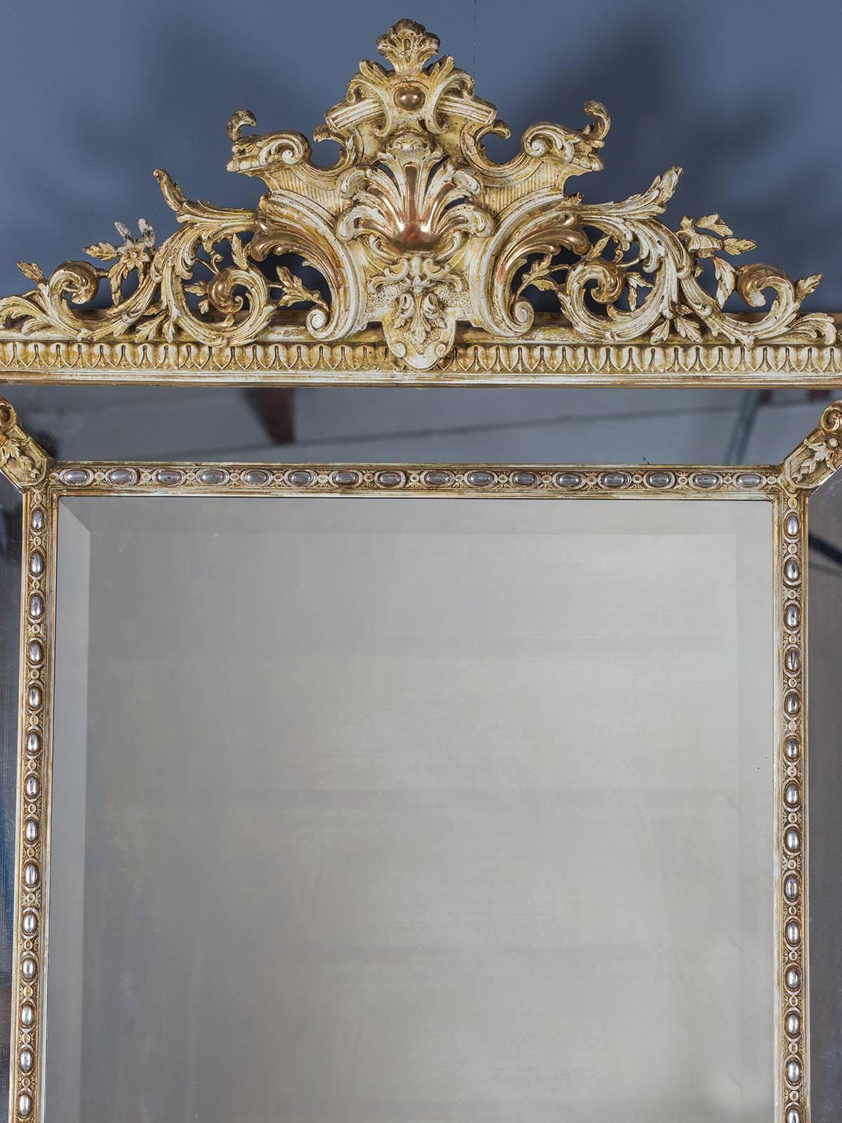 Receive our new selections direct from 1stdibs by email each week. Please click Follow Dealer below and see them first!

The beautiful combination of ivory color, silver and gold leaf and carved details gives this antique French mirror circa 1880