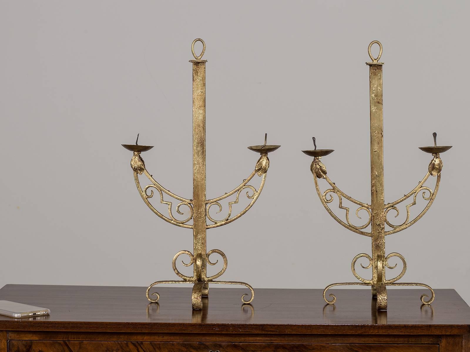 Receive our new selections direct from 1stdibs by email each week. Please click Follow Dealer below and see them first!

A striking pair of vintage French Art Deco period gilded iron candelabras circa 1930. The combination of scrollwork and