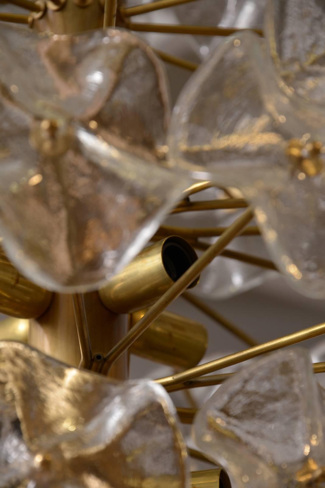Unusual round 1960s Italian Murano chandelier in brass and glass.