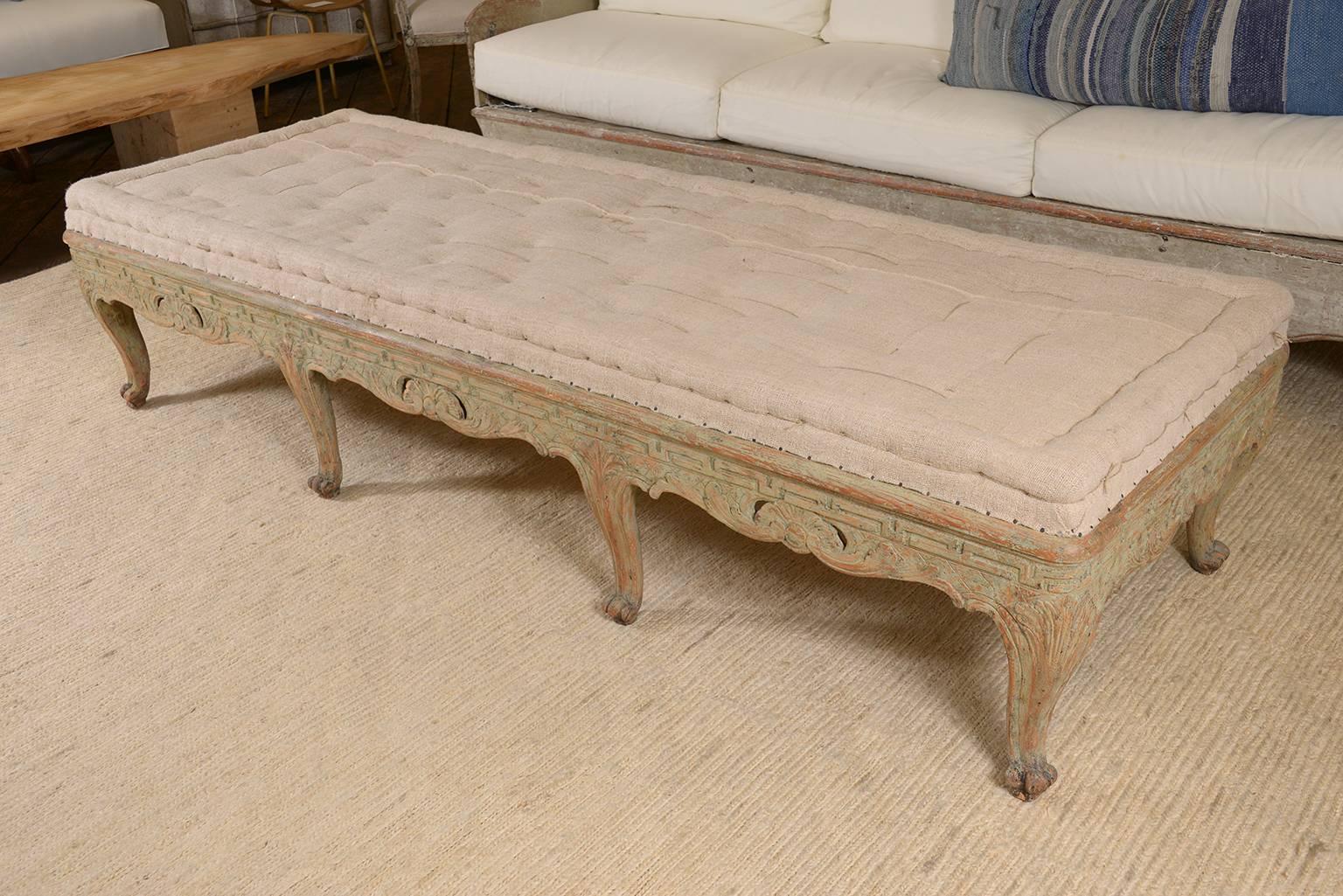 Handsome Swedish Baroque painted bench upholstered in antique linen, amazing large scale.