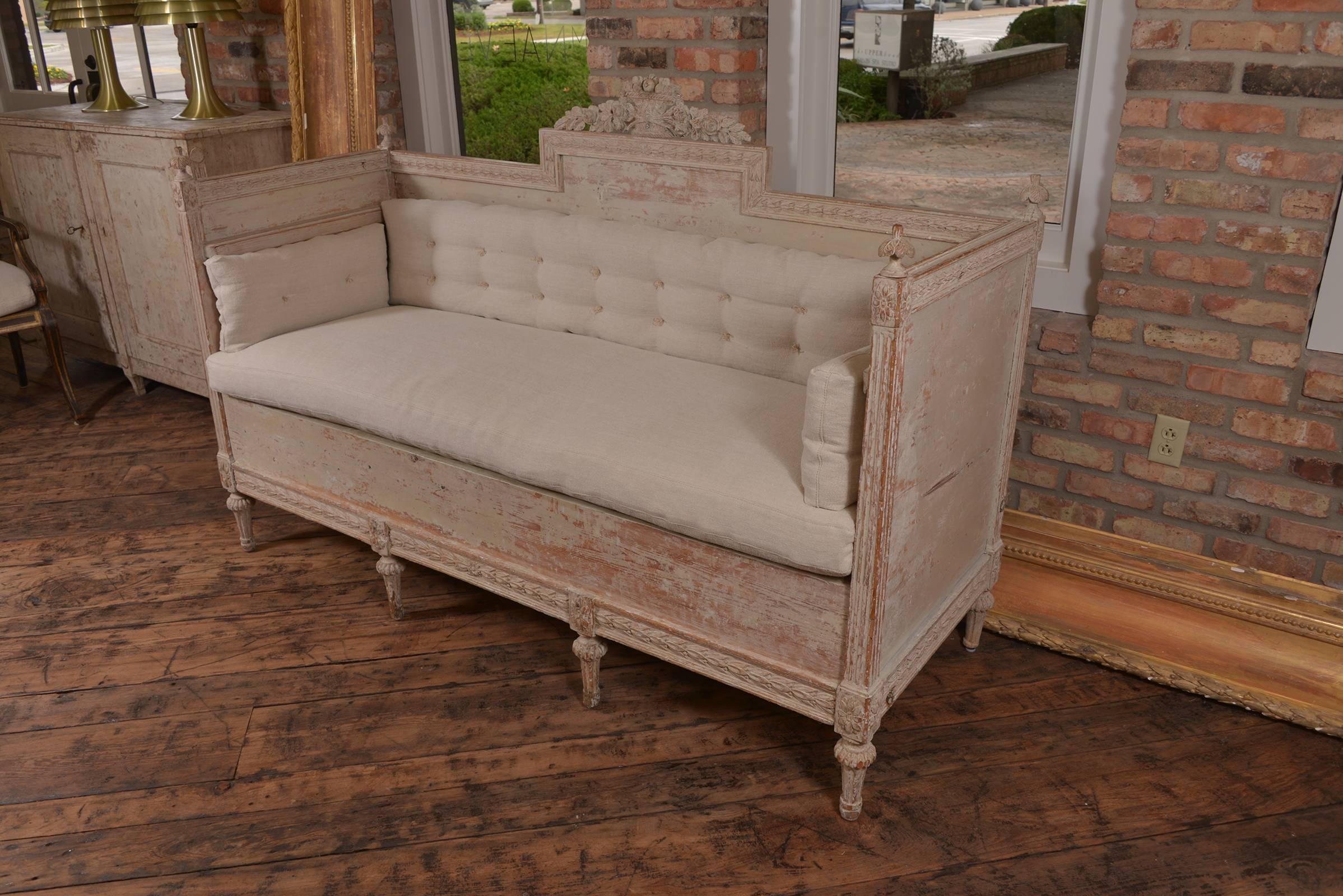 Stunning Swedish Gustavian period bench with ornate carving a details, new cushion just done in Holly Hunt linen. Scraped paint finish. A real beauty.