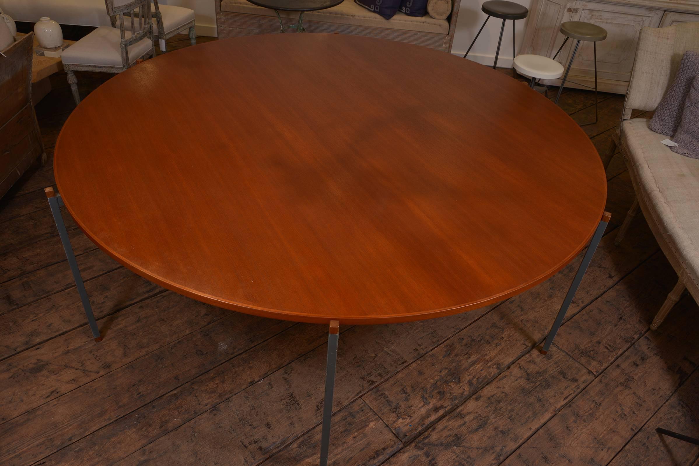Very chic and large scale Danish dining table, simple painted iron base with mahogany wood top that has been waxed. 1950s.