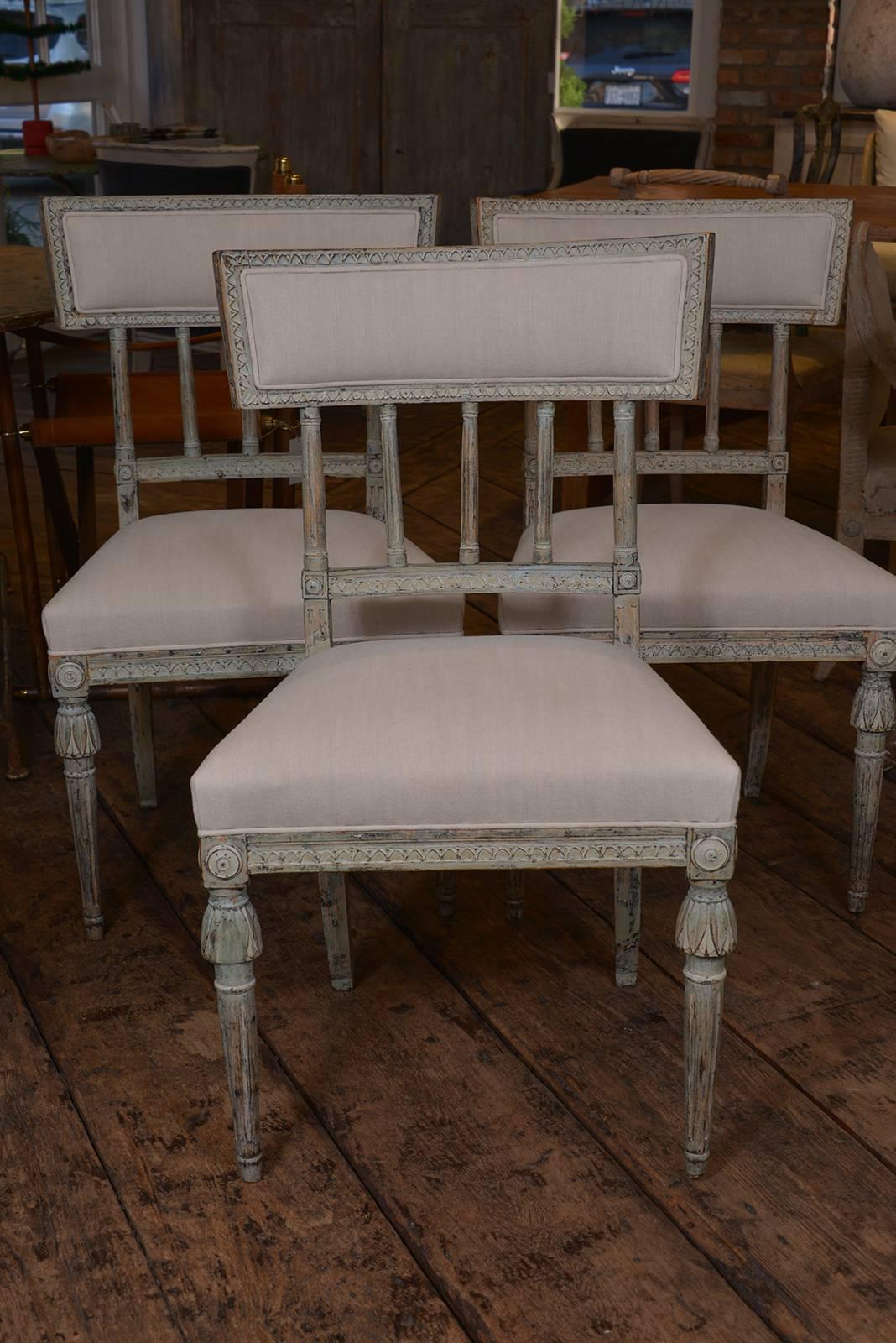 A set of four Swedish Gustavian chairs circa 1810-1815 in original paint. Generous size.