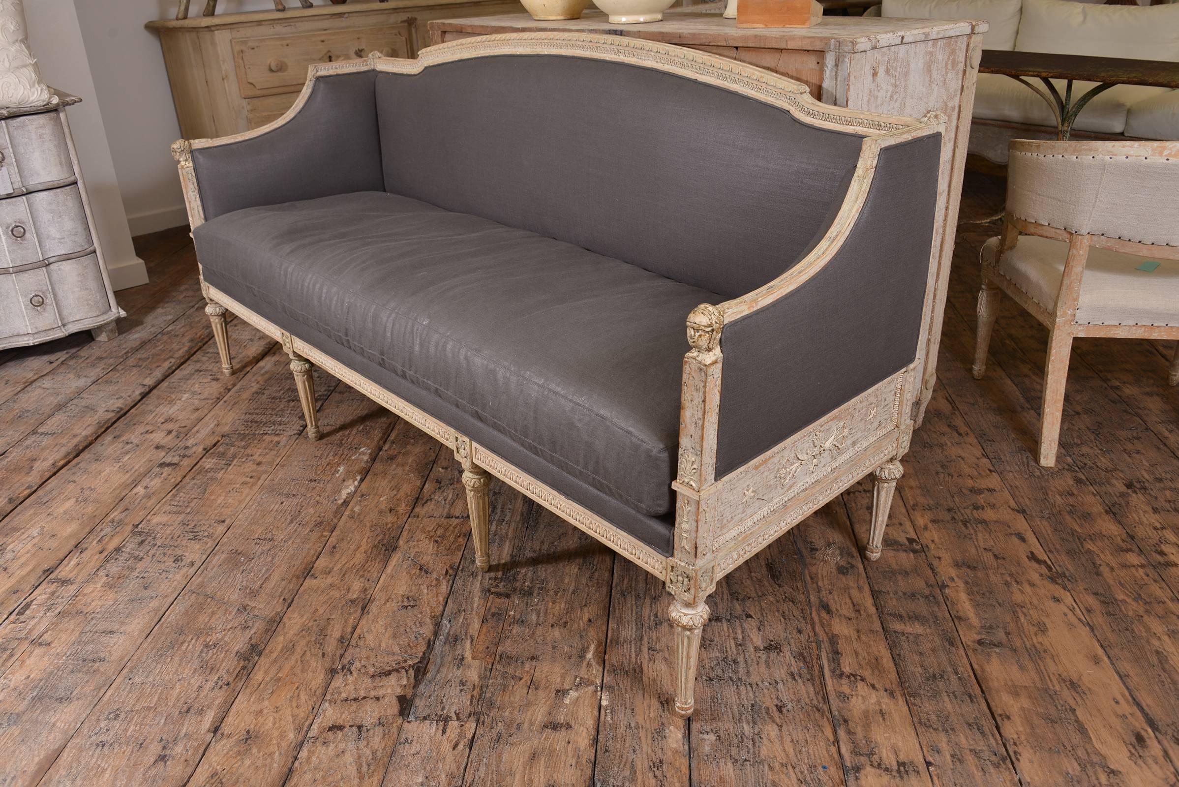Stunning Swedish Gustavian bench upholstered in Holland and Sherry glazed linen charcoal.
Beautiful carving, scraped paint finish. A very chic piece.
 