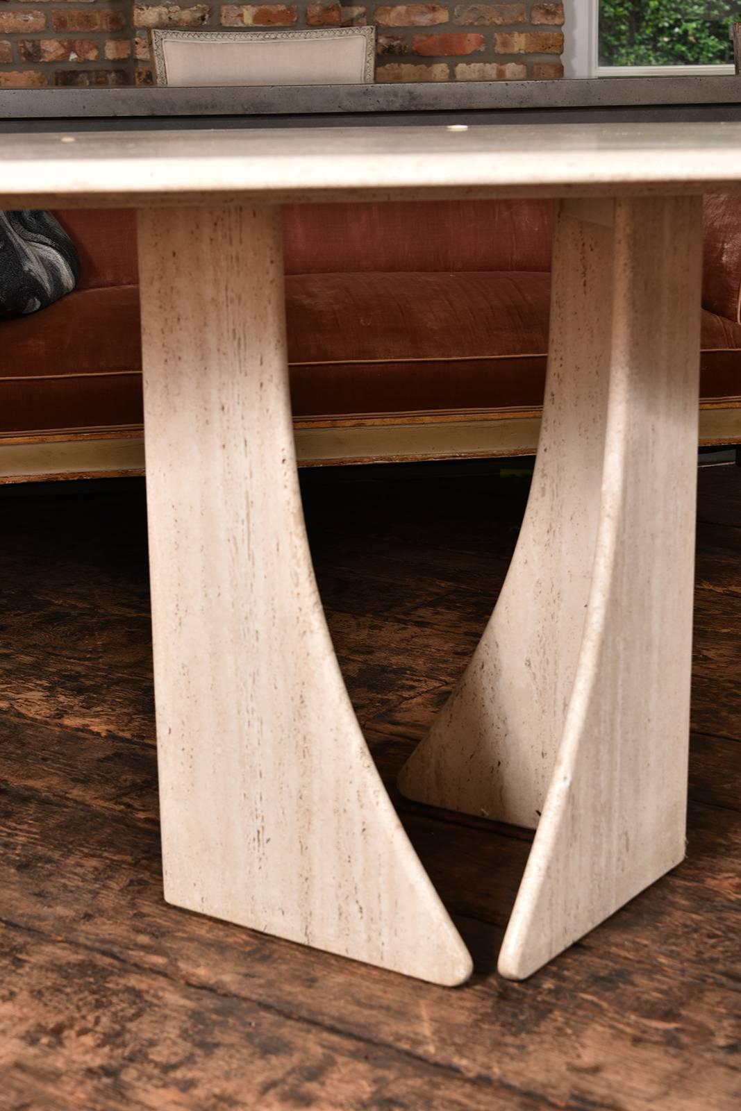 Very sophisticated French oval travertine table, from the 1960s.