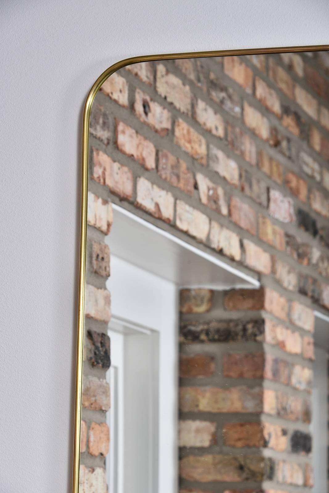 1950s thin frame brass Italian mirror.