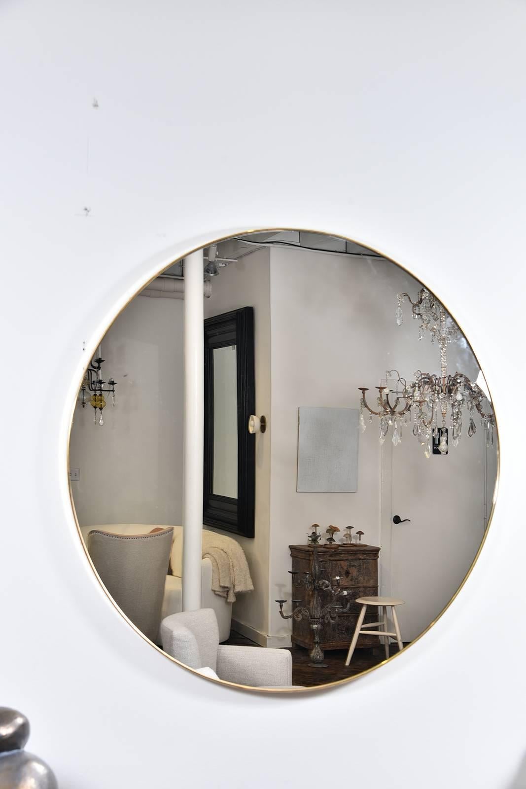 Super chic round, large thin frame brass mirror from the 1960s. A fabulous piece!