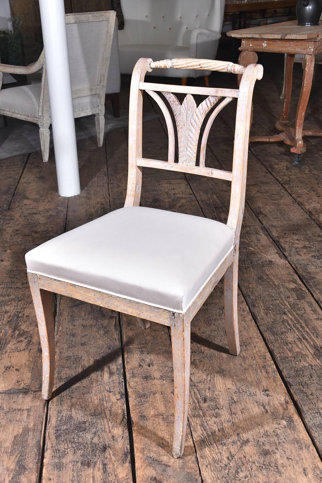 Six Gustavian dining chairs. Dry scraped to the original paint, circa 1810. Upholstered in Holland and sherry wool.