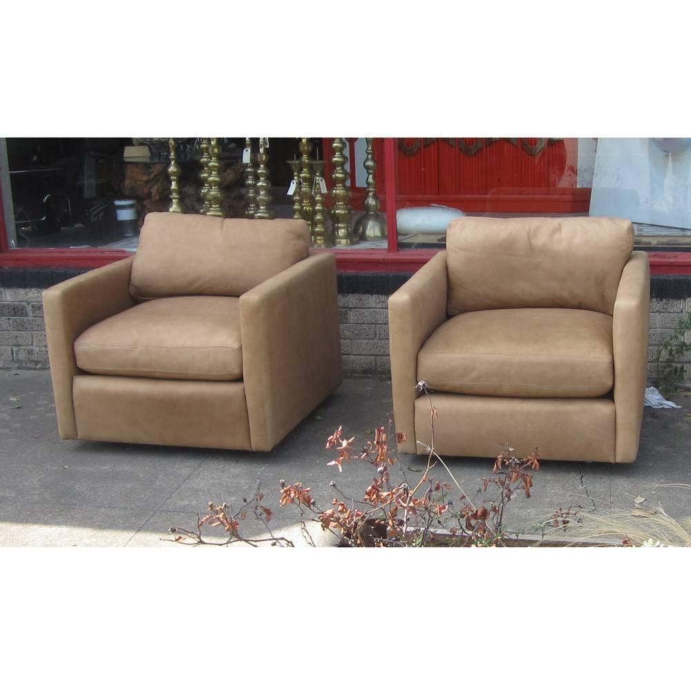 Pait of Pfister Style Lounge Chairs  

Light tan leather with down cushions. Very comfortable.
 