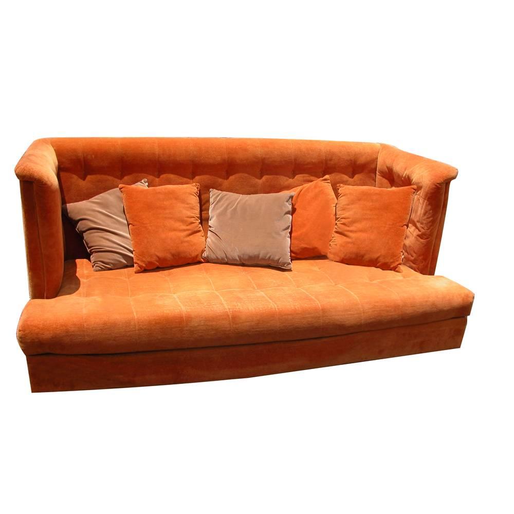 Shelter sofa by Milo Baughman,

1973.

Rare sofa, with high back and arms. Classic and modern with tufting.

Has one matching ottoman with storage for pillows.
             
