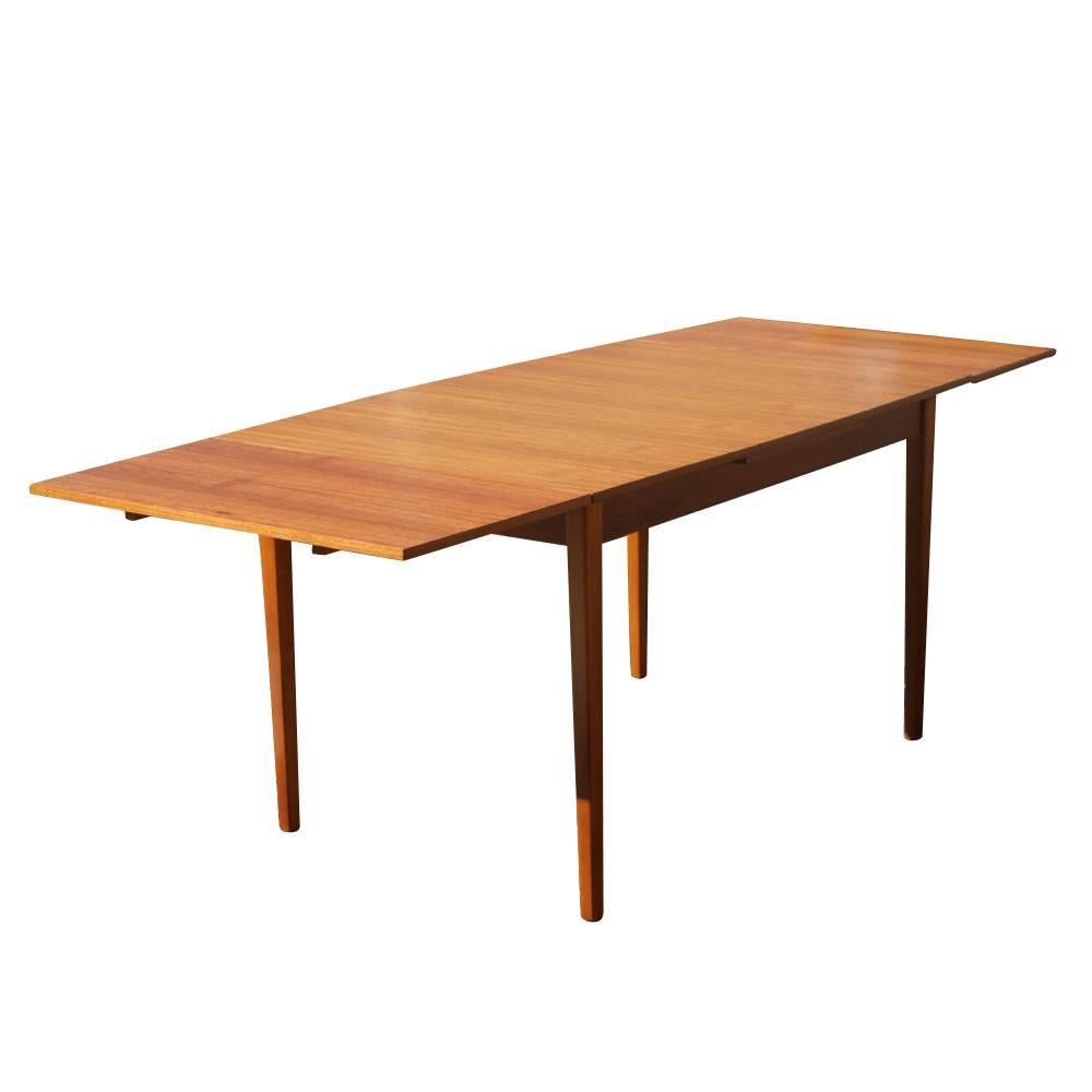 Danish teak extension dining table, 
1960s. 
Two pull-out leaves.
Extends from 47.75" to 79.25".