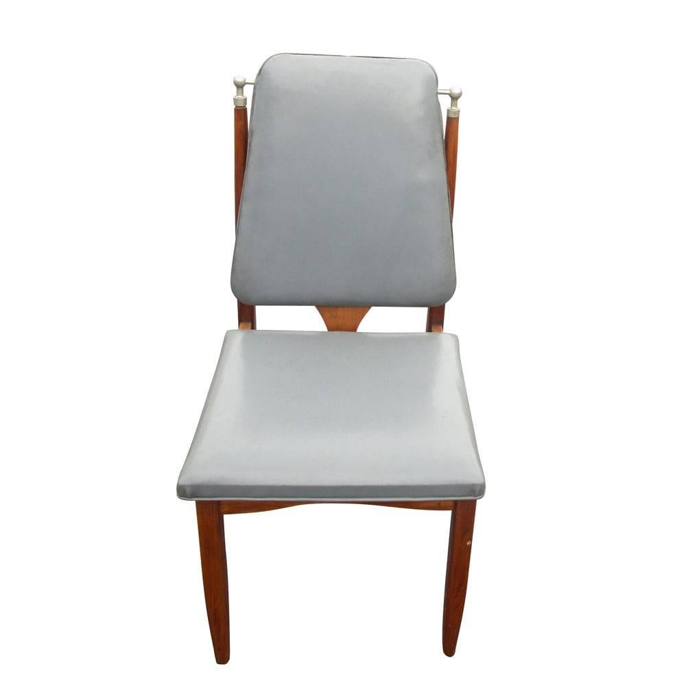 Vintage Mid-Century set of six (6) dining chair.
Grey vinyl upholstered seat and back.
Wood frame with chrome corners,
circa 1960s.

Measures: 17.5
