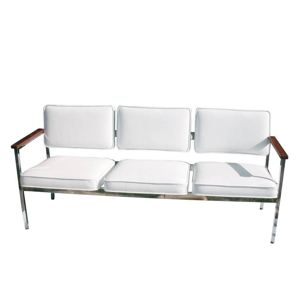 Vintage Mid-Century.
Three-seat steel case sofa.
 
Chrome with new white leather
Oak finish armrests

Restored 
 